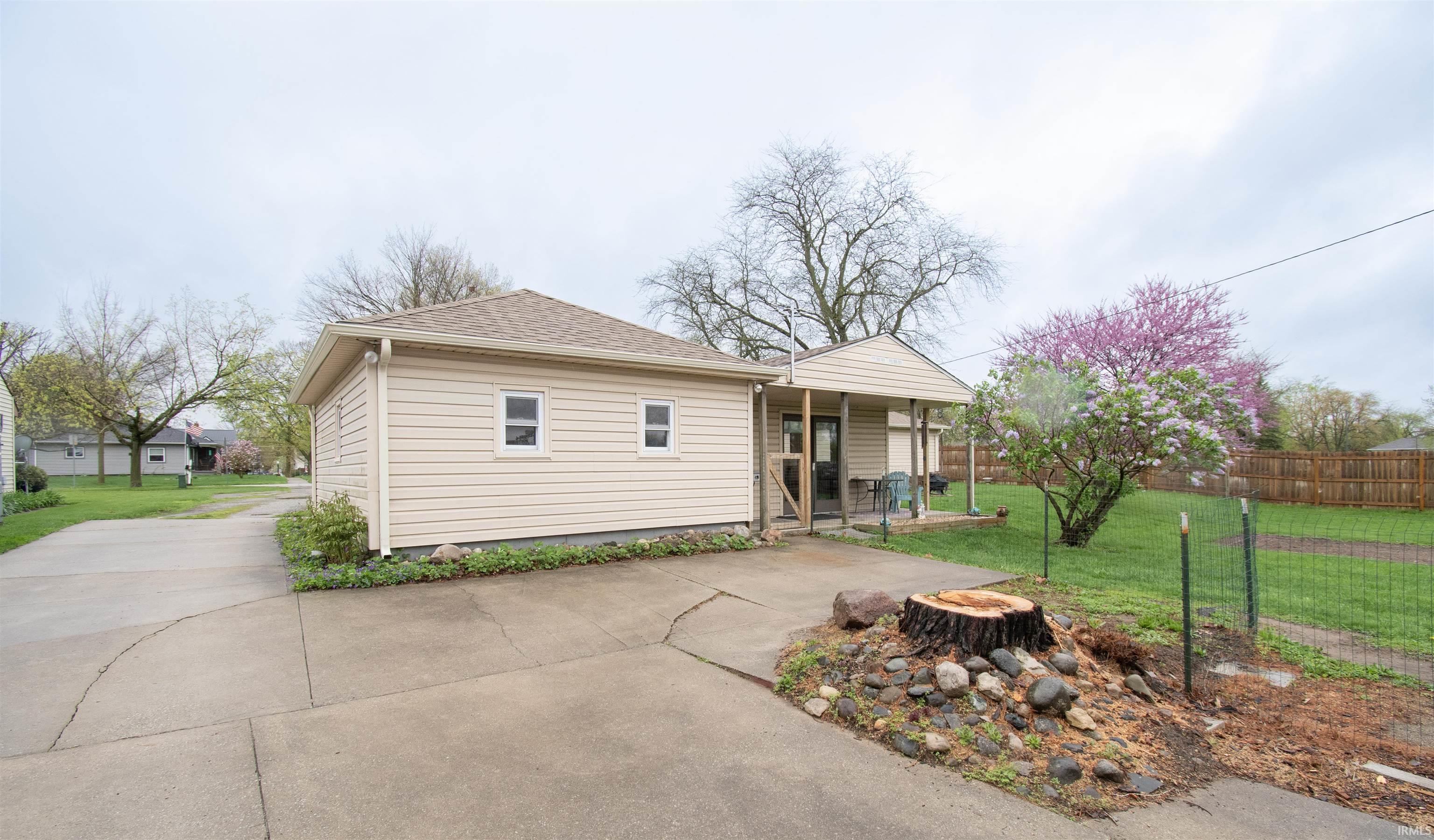 View of front of home with roof with shingles