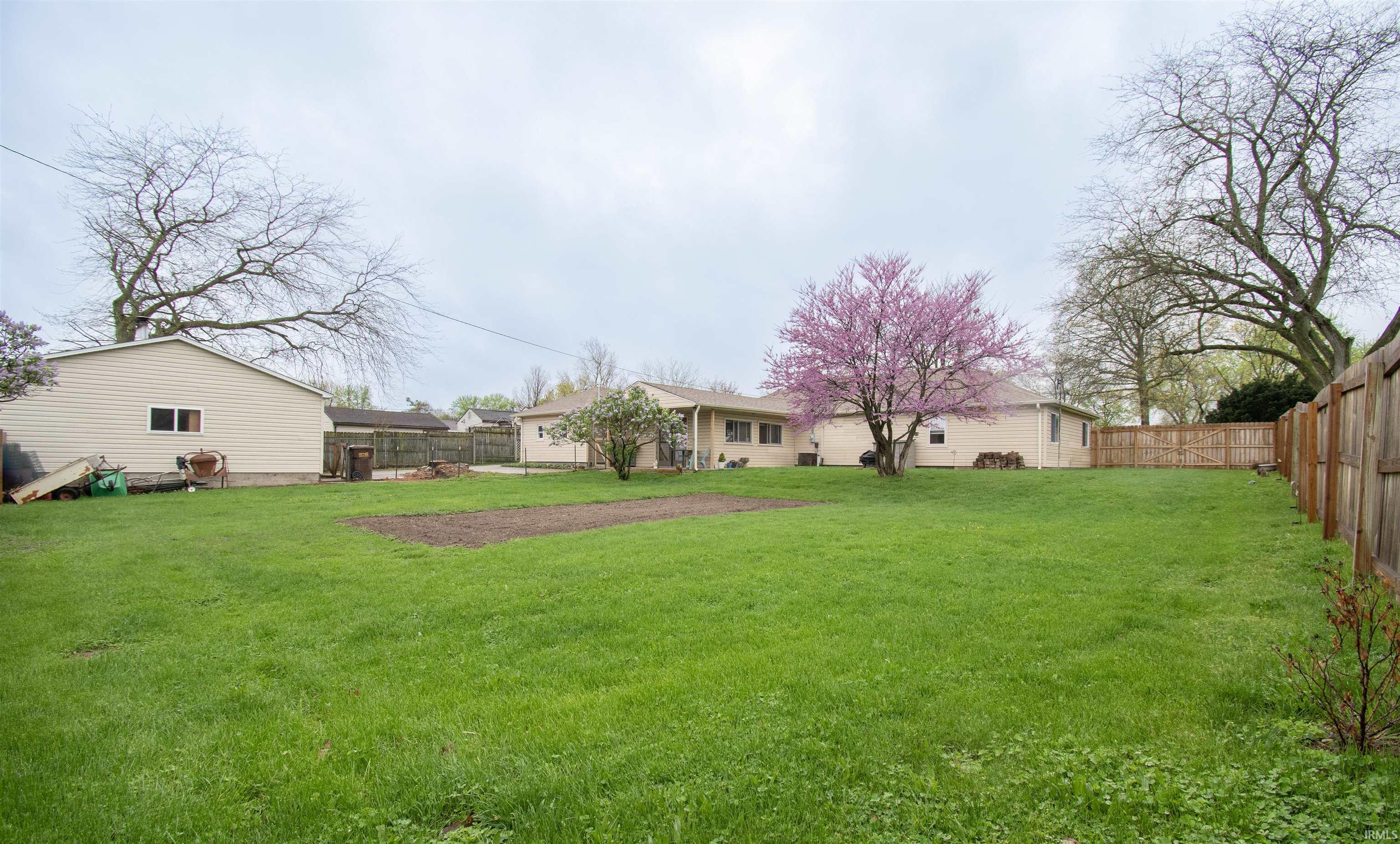 View of fenced backyard