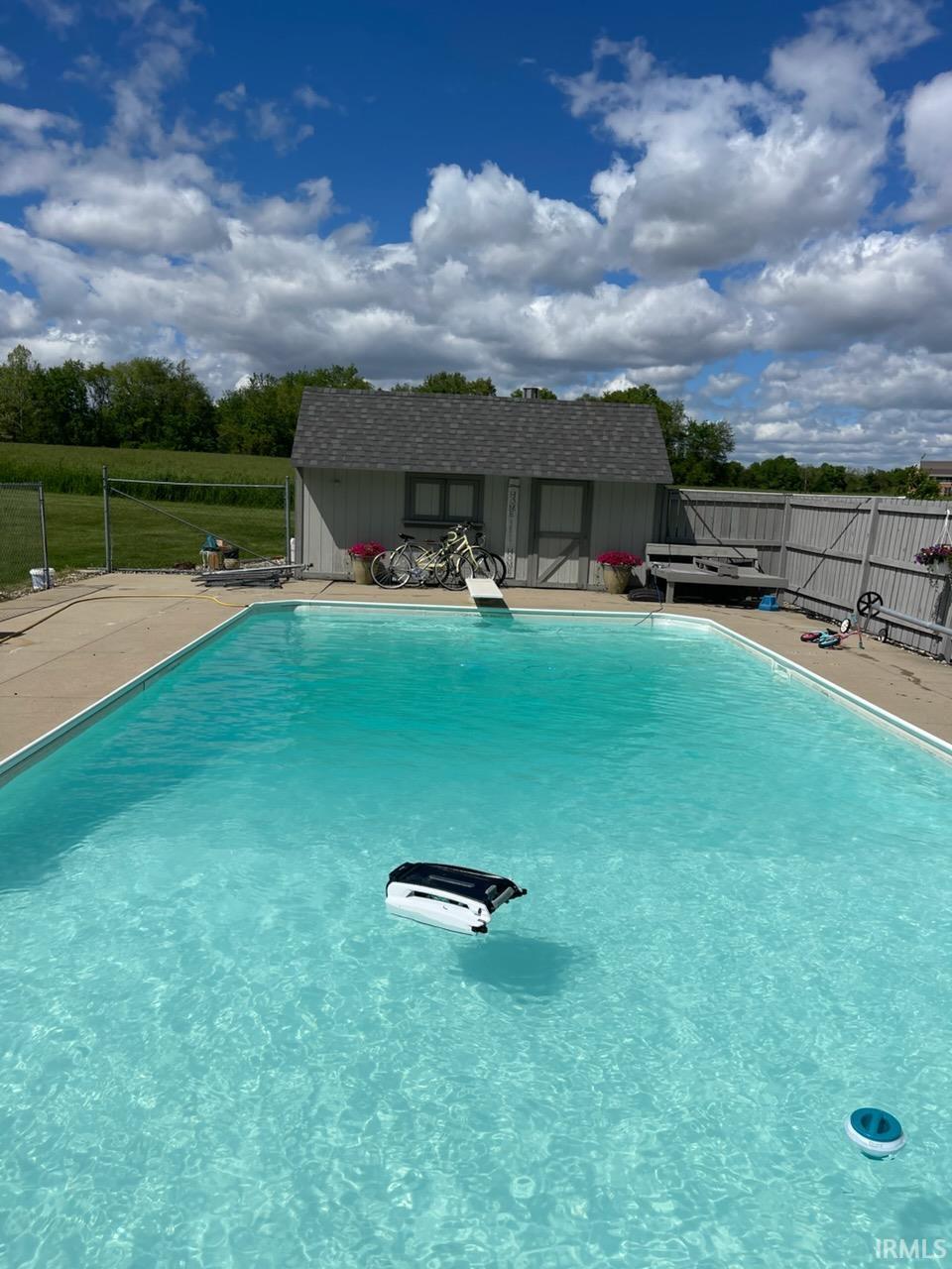View of pool featuring an outdoor structure