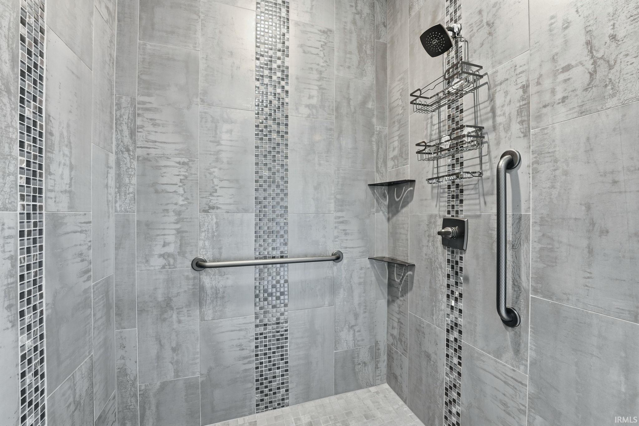 Full bathroom featuring a tile shower