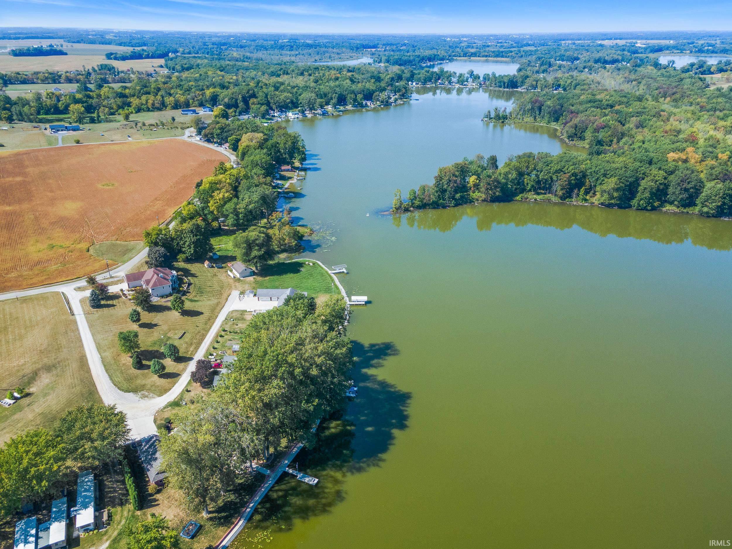 Aerial view of property's location featuring a large body of water