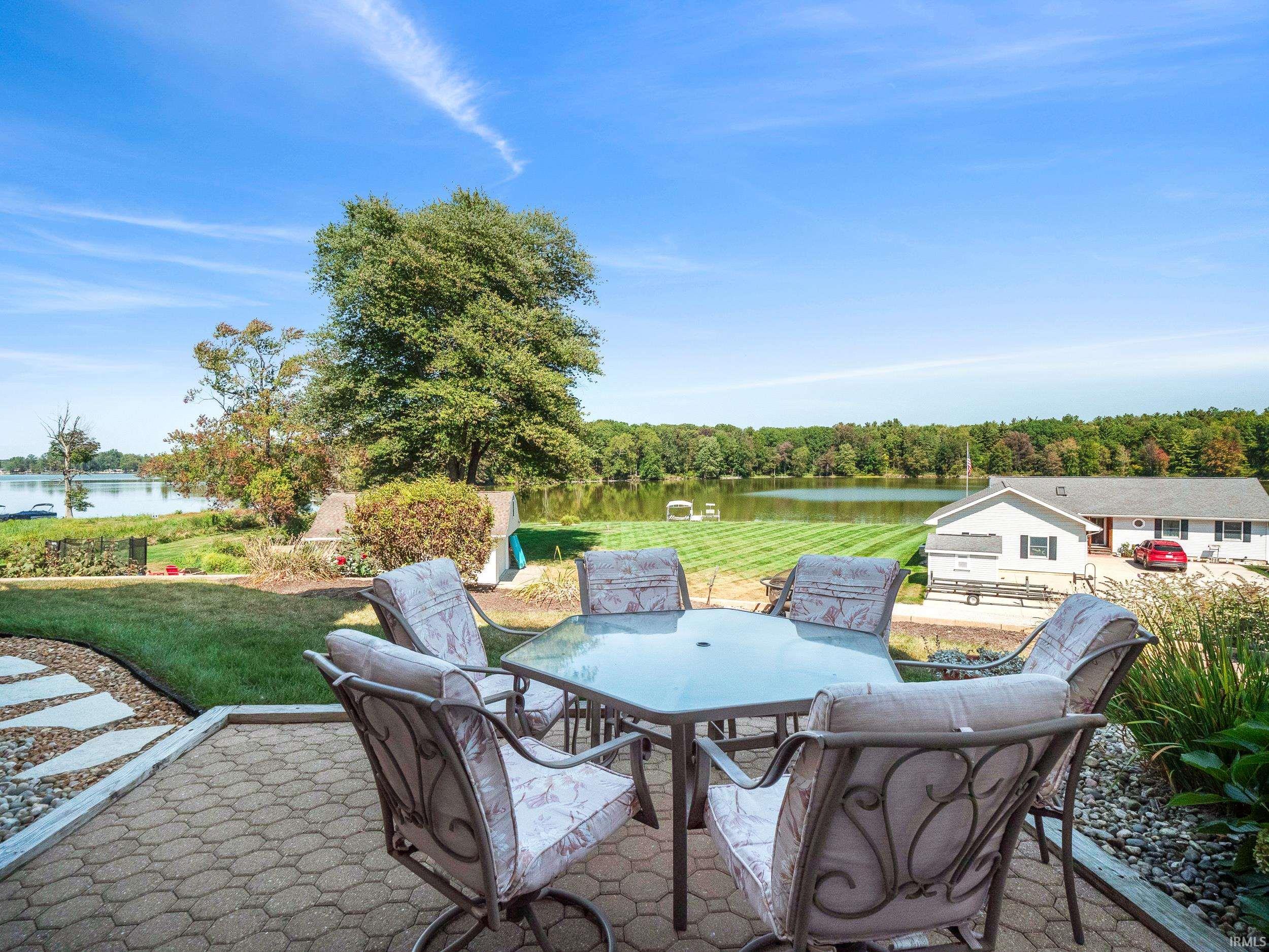 View of patio featuring outdoor dining area and a water view
