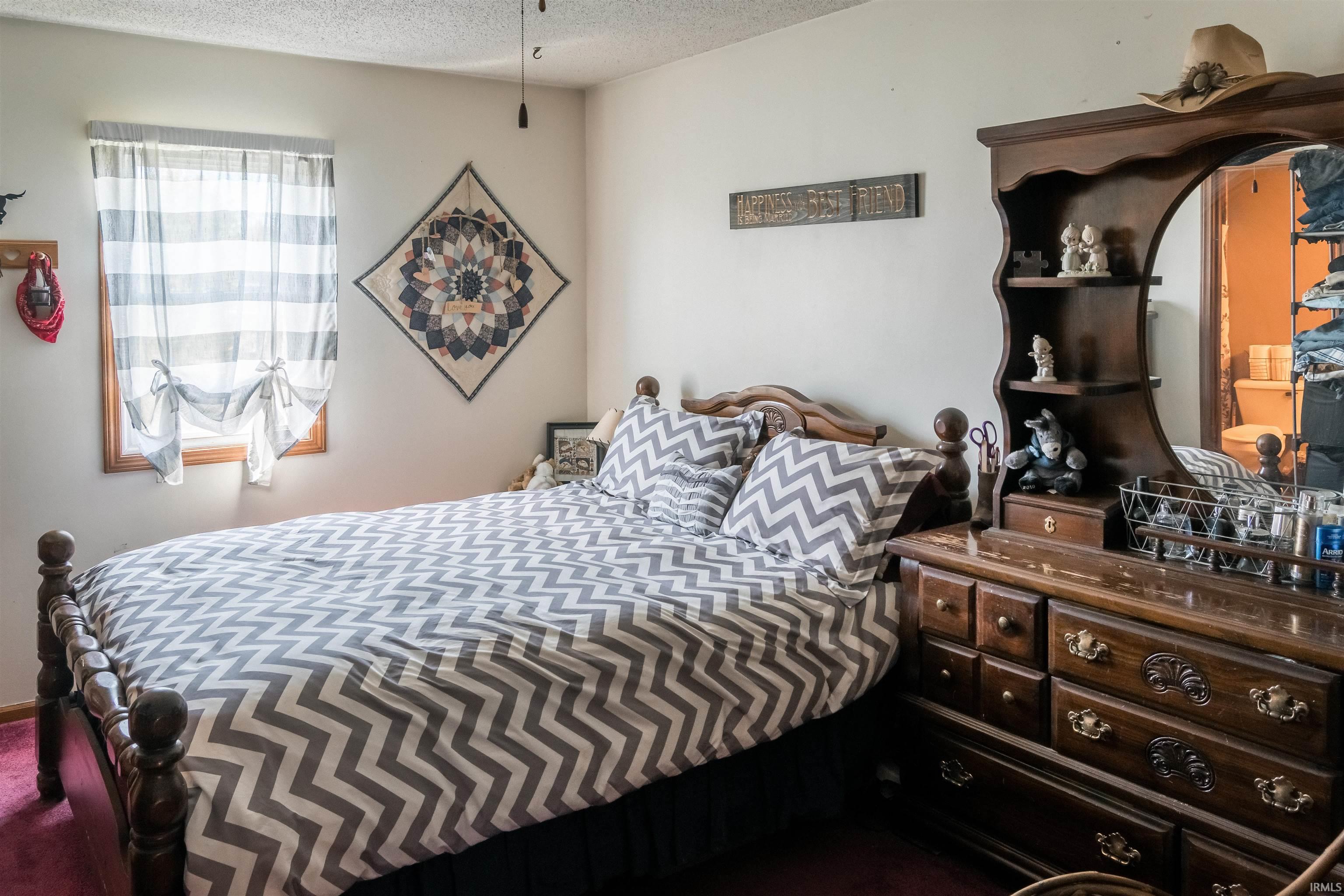 Bedroom with a textured ceiling