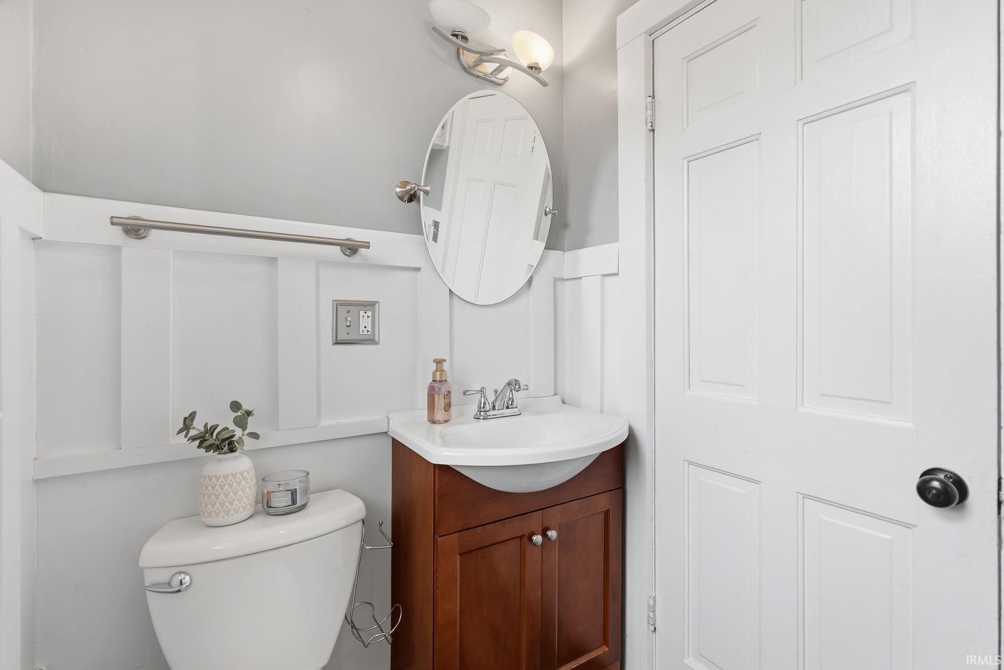 Half bath with vanity and toilet