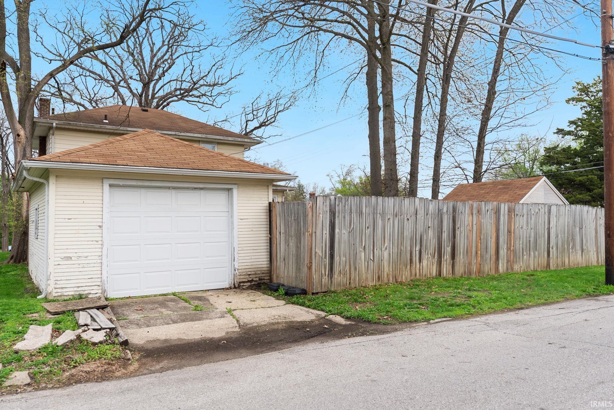 Detached garage with concrete driveway