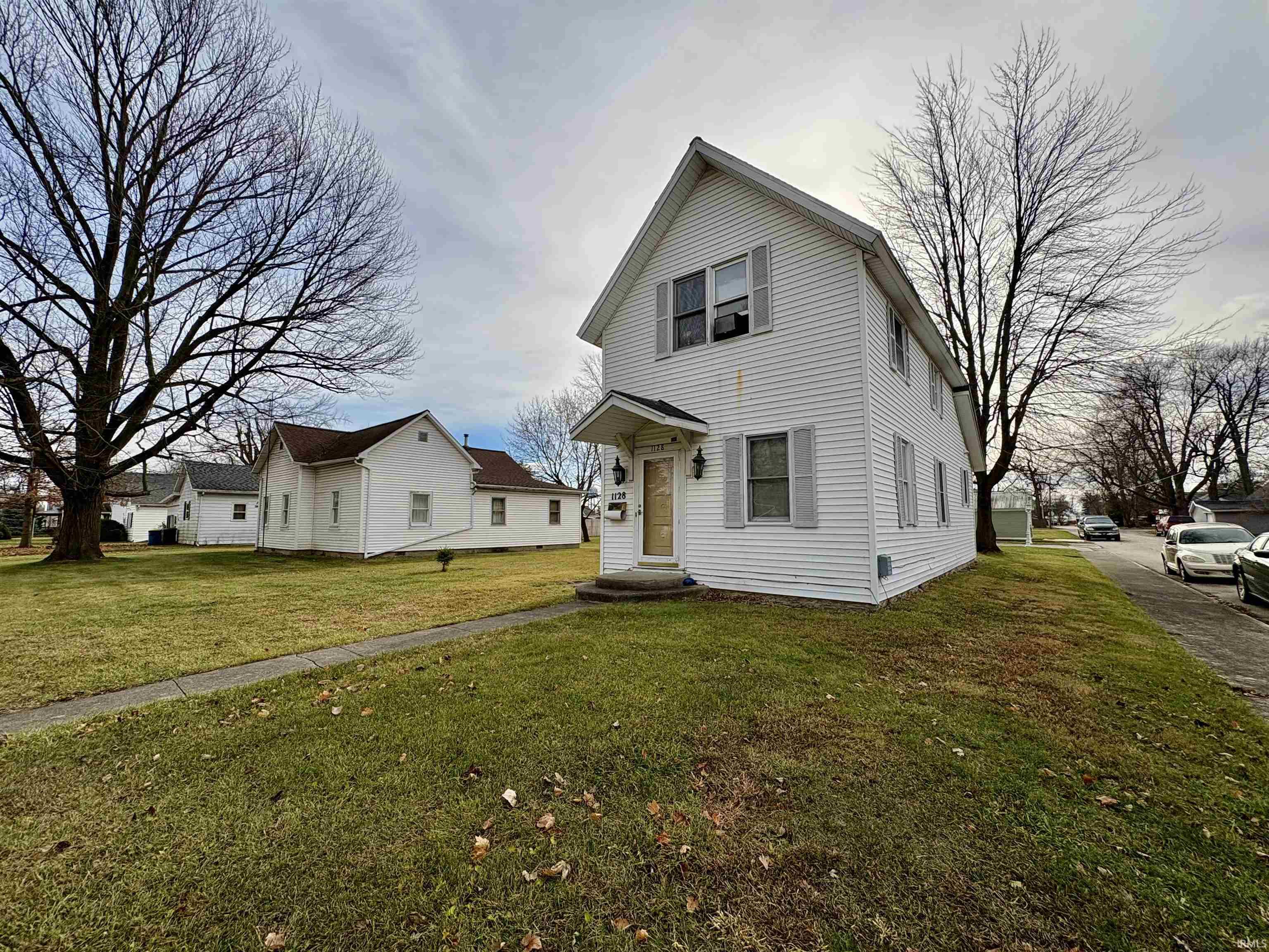 Traditional-style home with a front lawn
