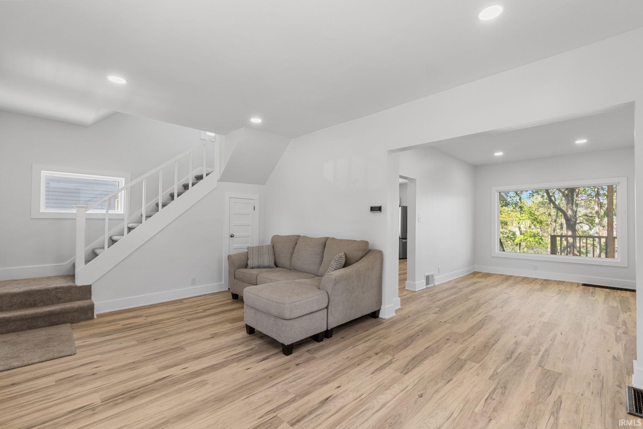 Sitting room featuring light wood-style floors and recessed lighting