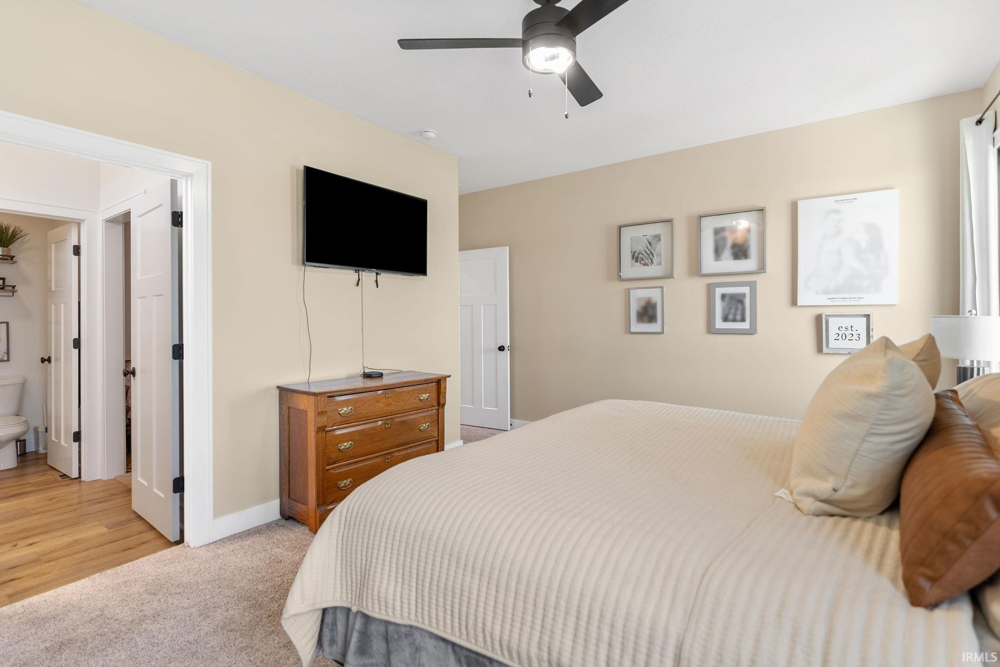 Neutral-toned walls complement plush carpeting