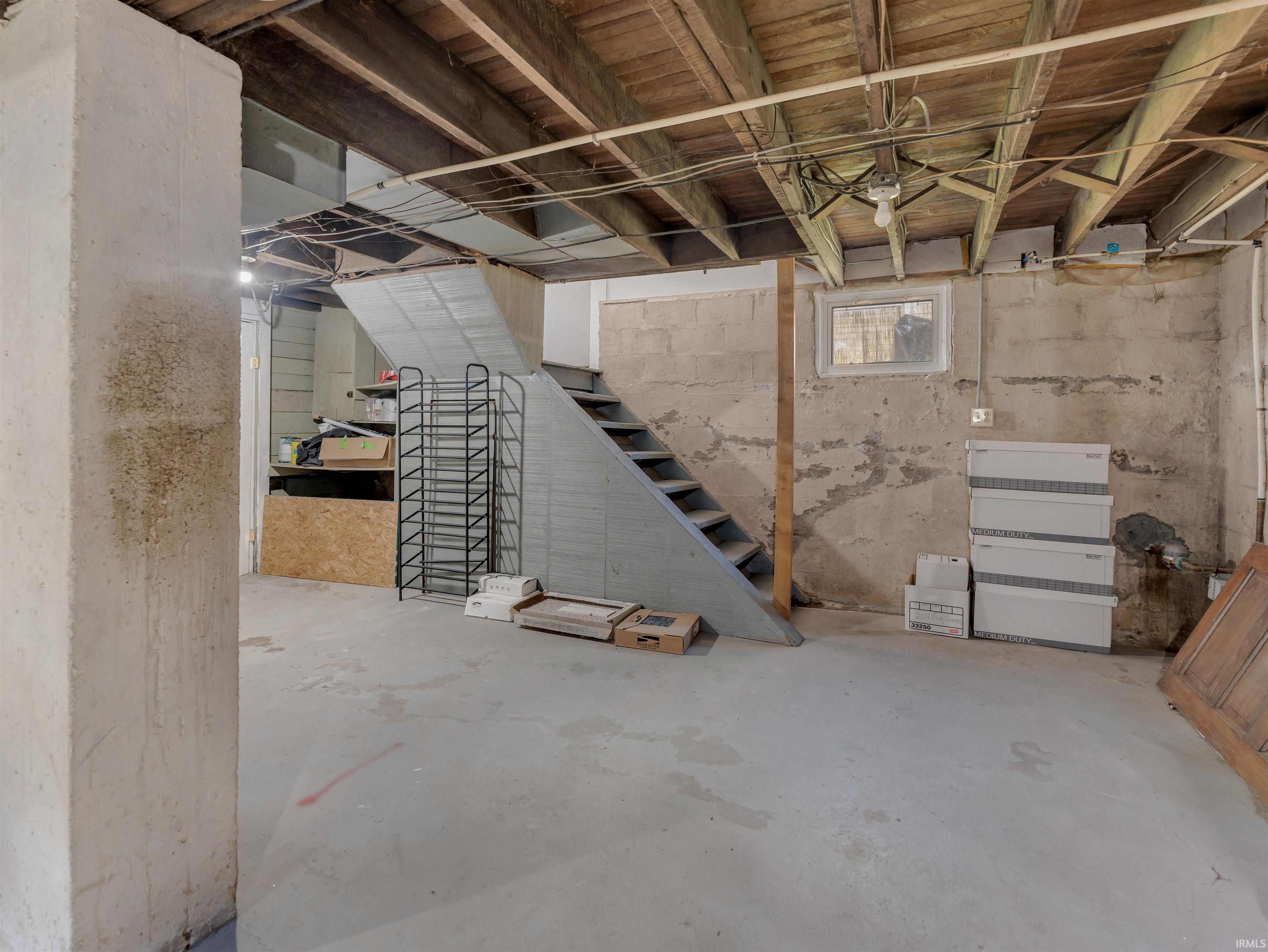 Below grade area featuring stairway