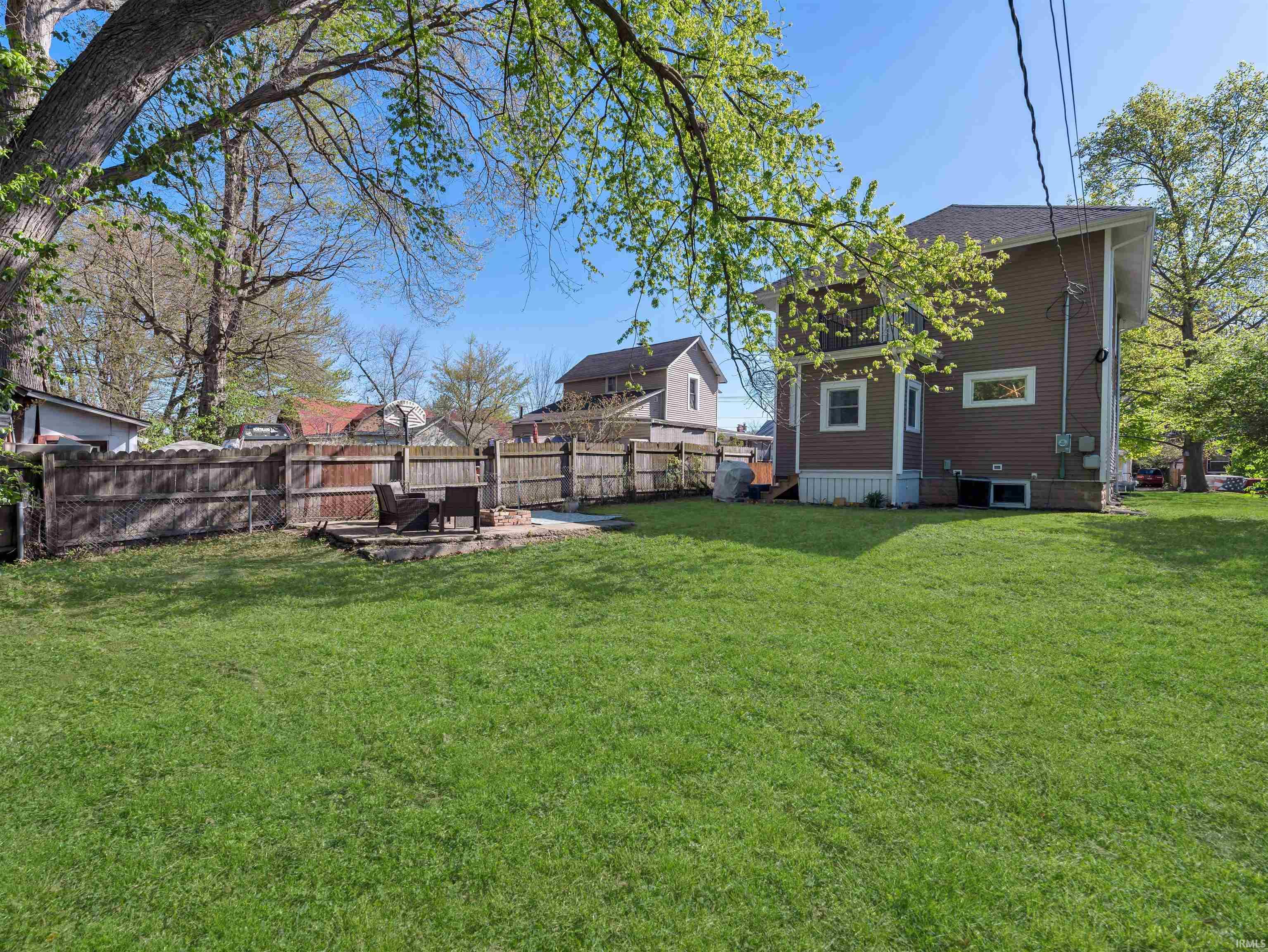 Fenced backyard with a patio