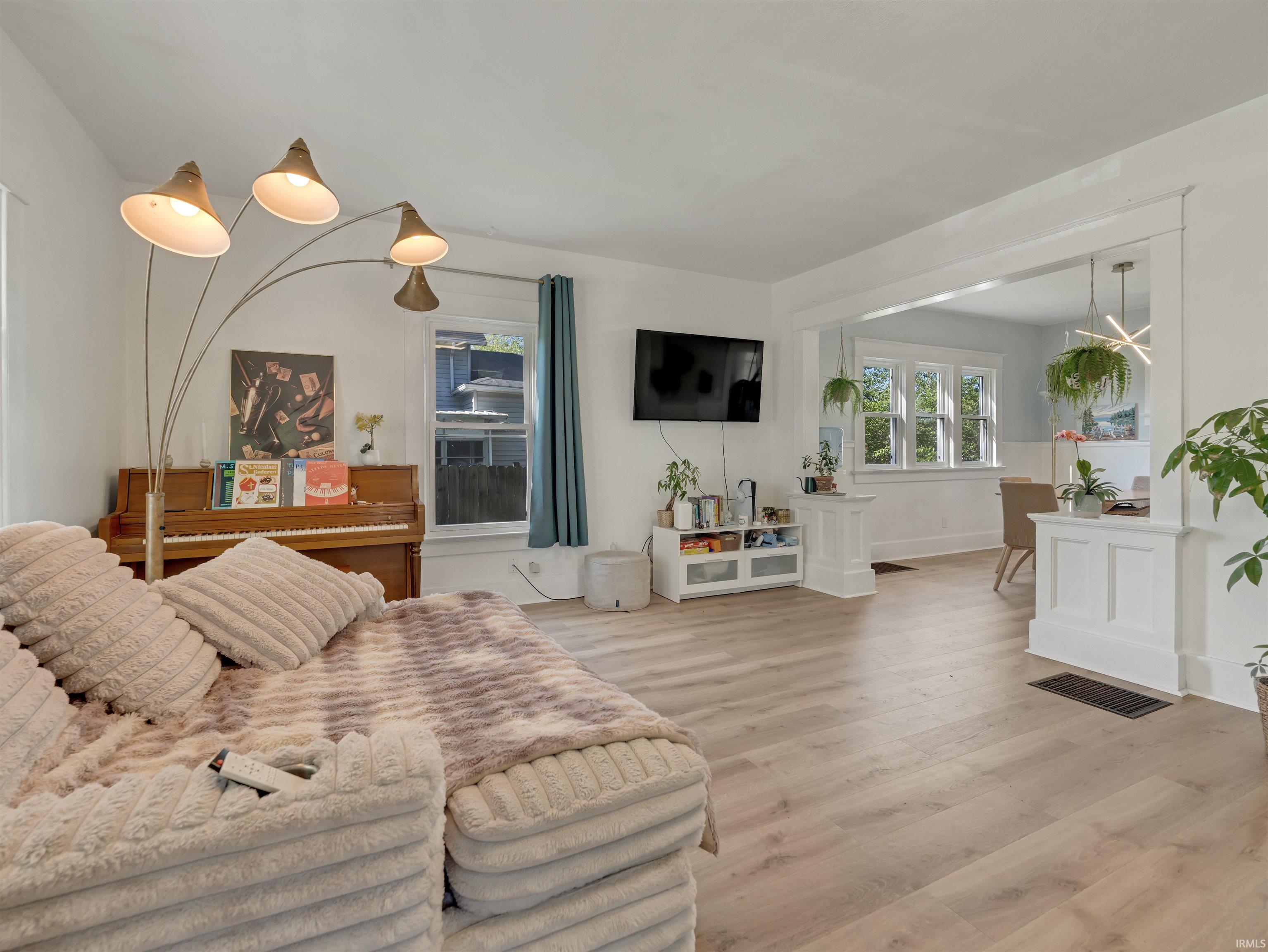 Living room featuring light wood finished floors and baseboards
