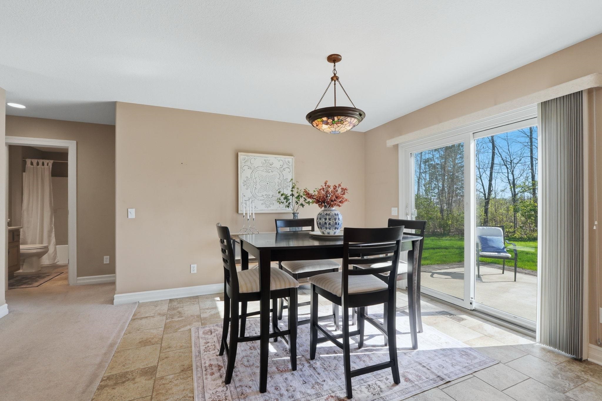 Dining space with baseboards and a chandelier