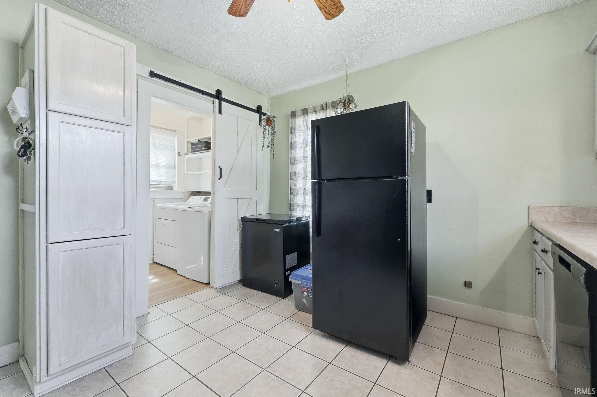 Tile flooring throughout kitchen area