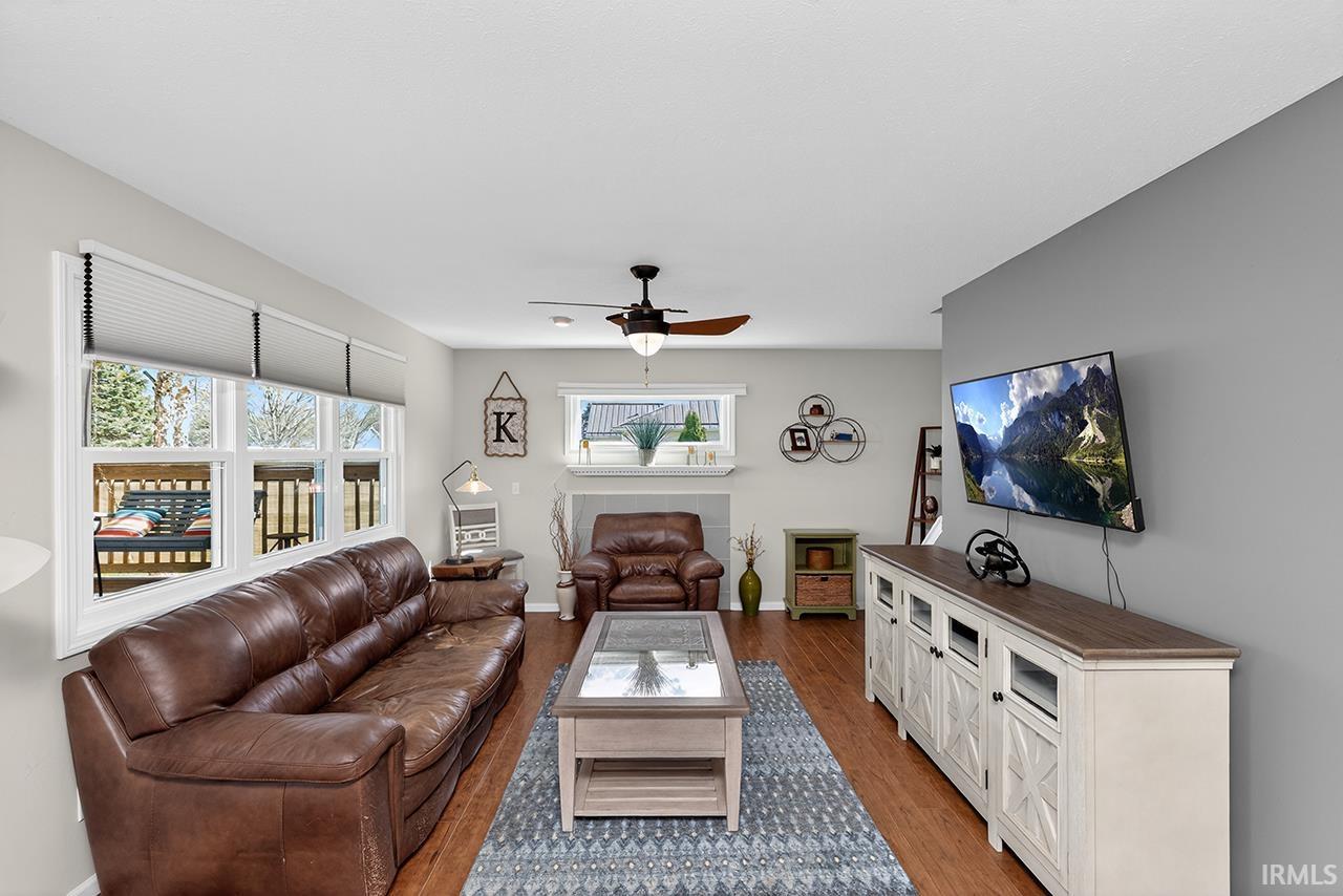 Living area featuring a ceiling fan and wood finished floors