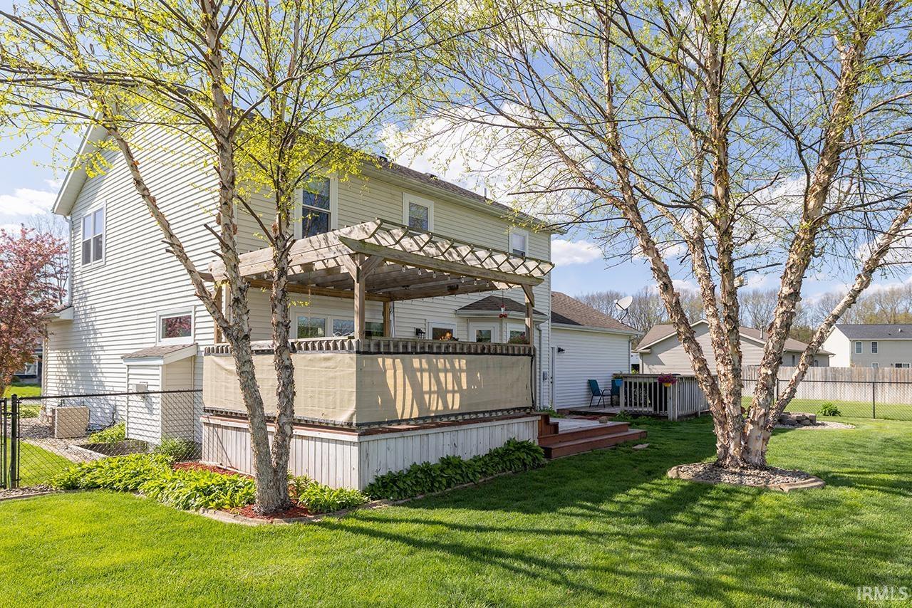 Back of property with a deck