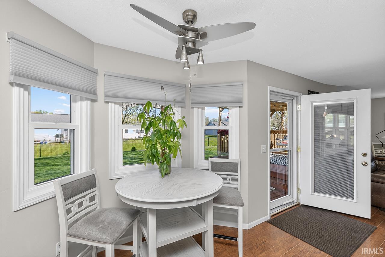 Sunroom with wood-type flooring