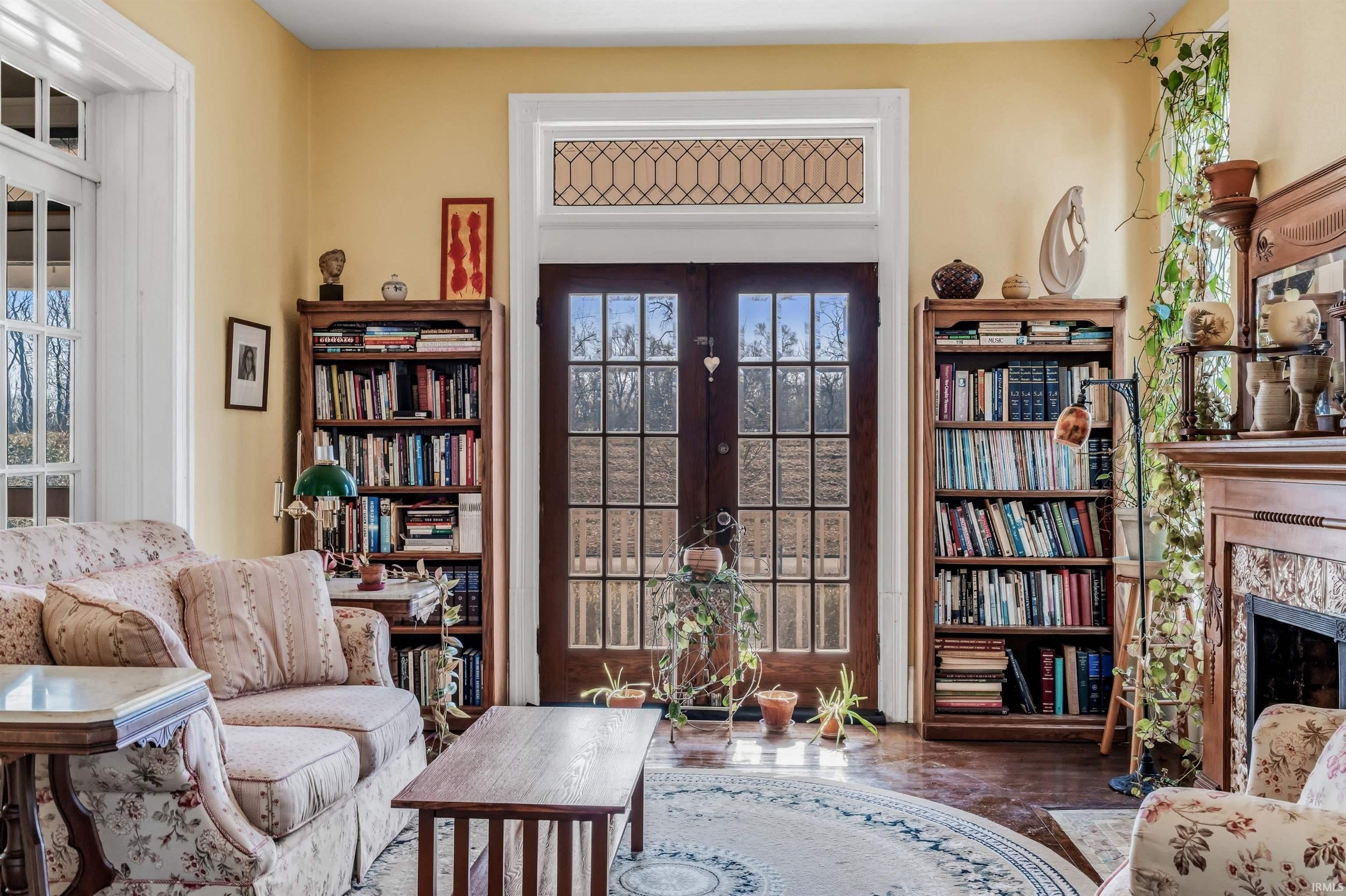 Sitting room featuring french doors and a fireplace