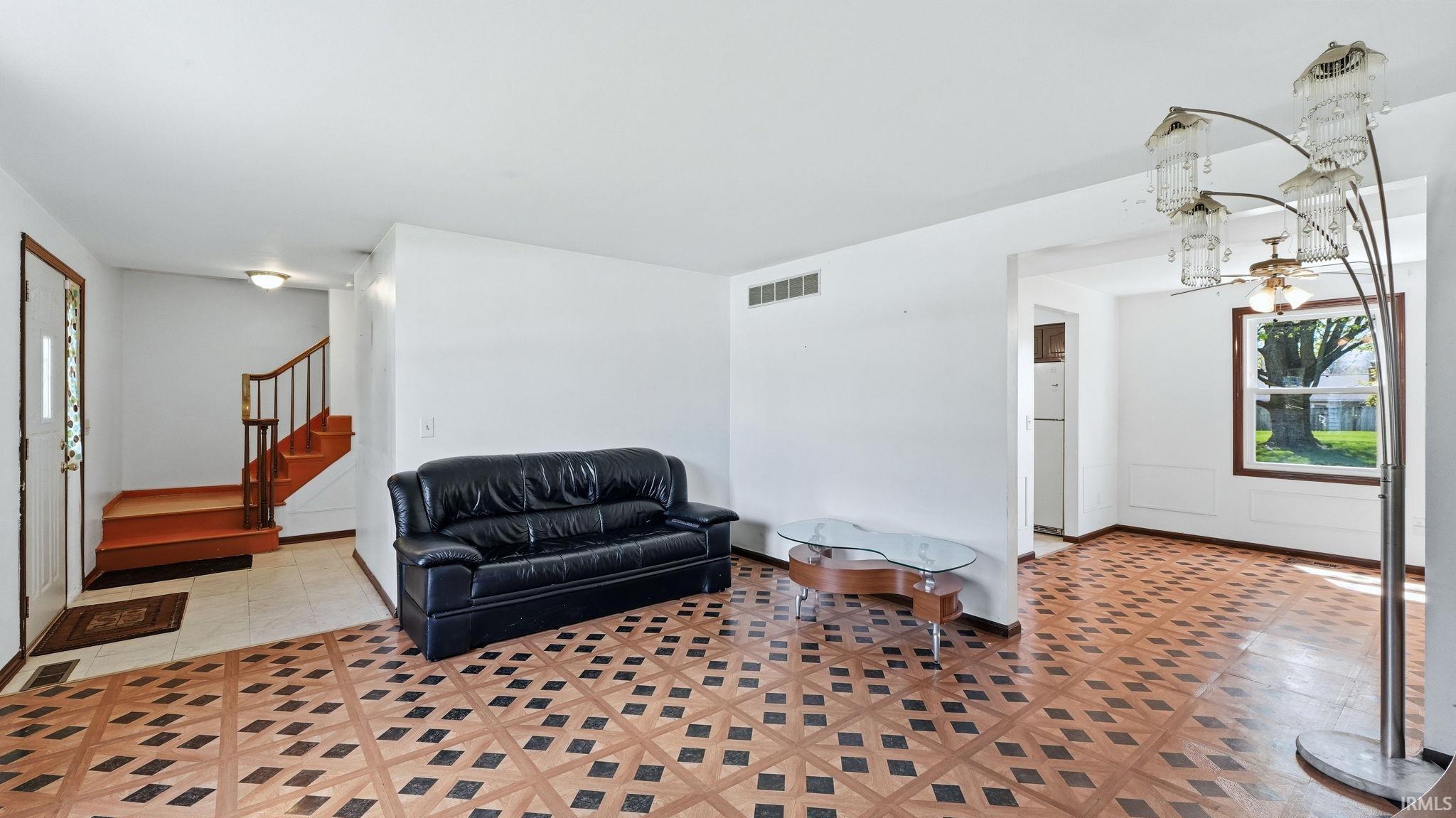 Main living area featuring patterned flooring