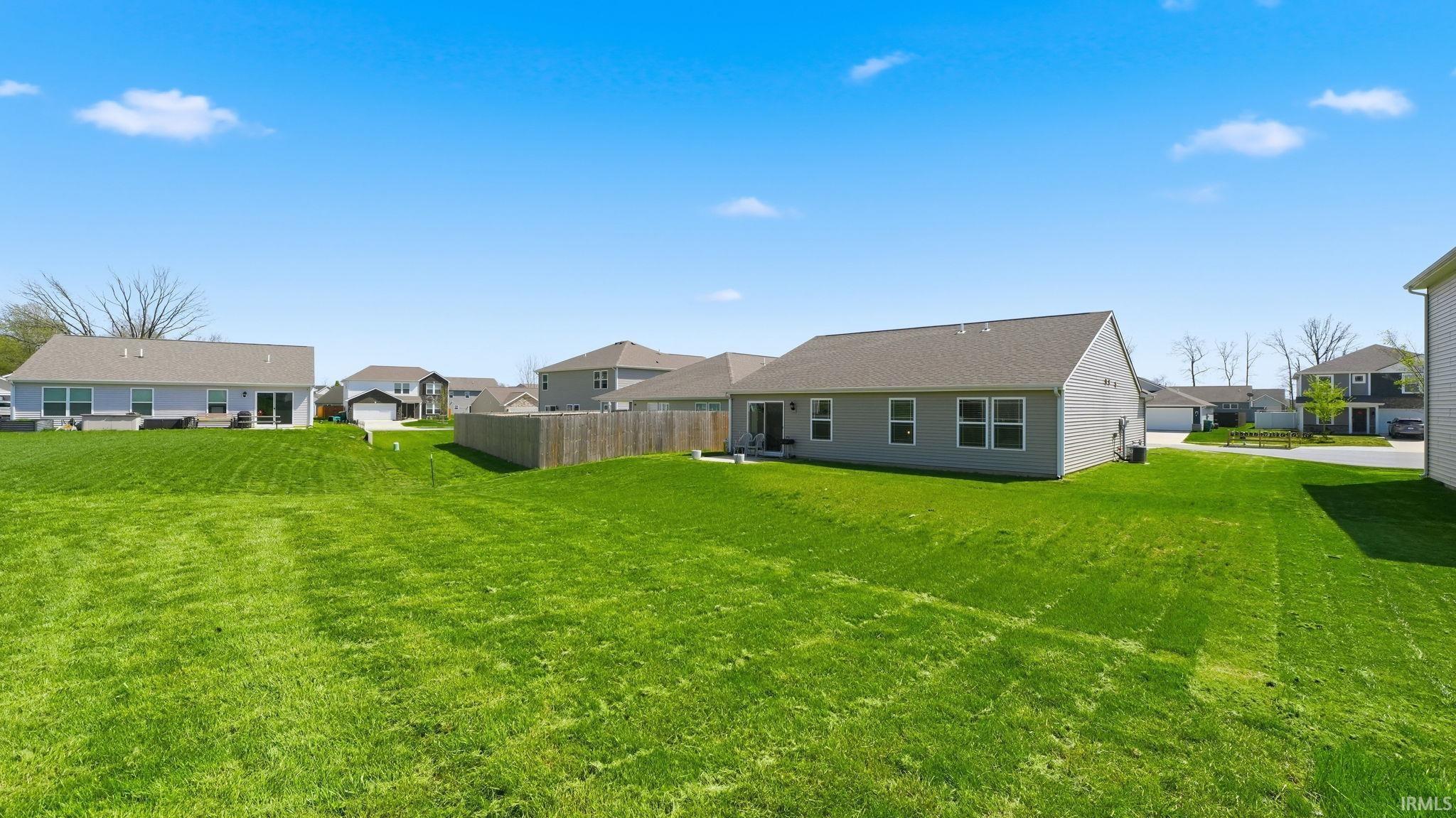 Expansive backyard with a large grassy area