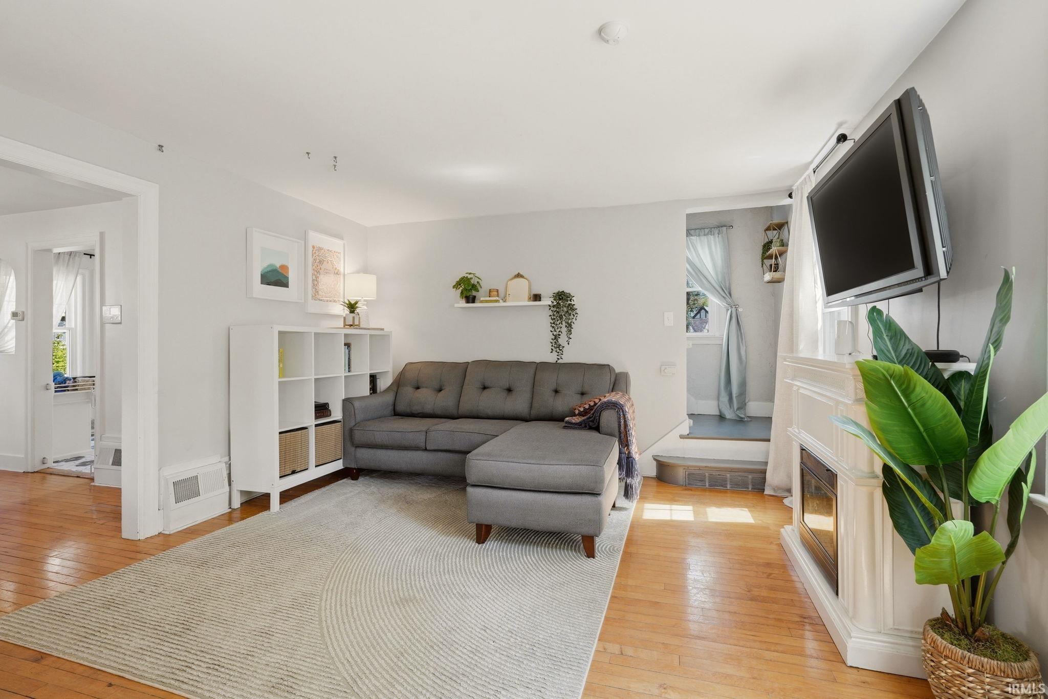 Hardwood flooring throughout the living space