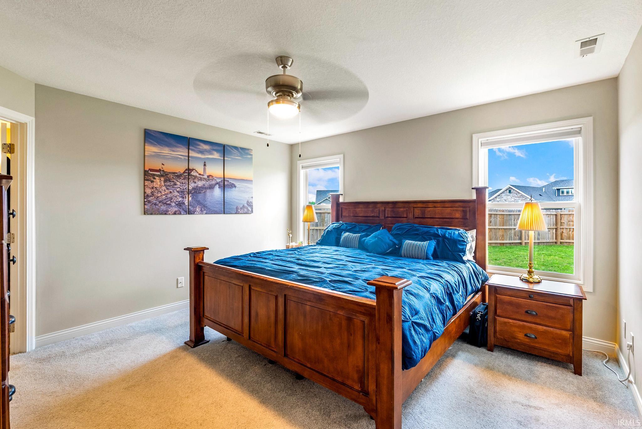 Carpeted bedroom with neutral wall tones