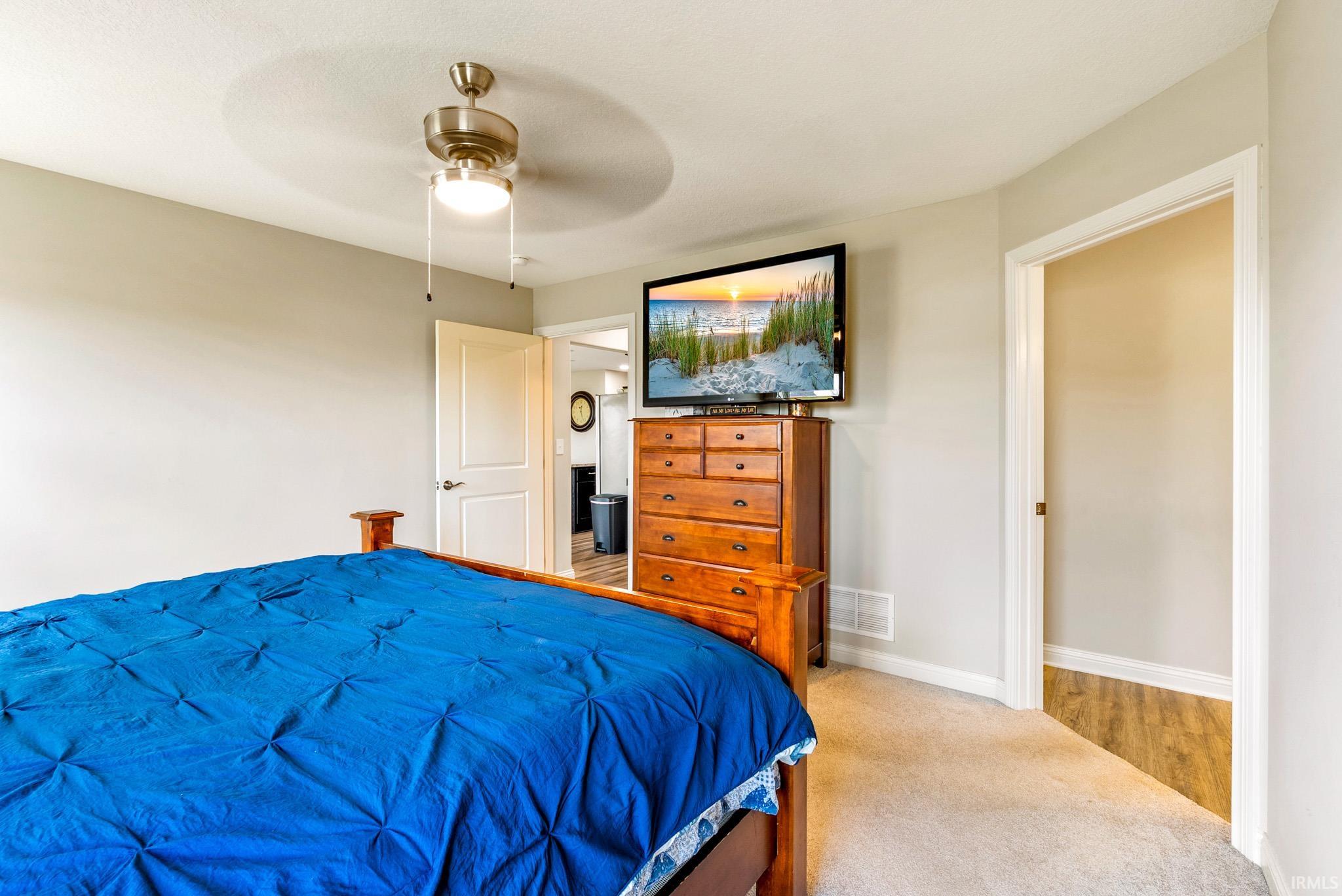 Neutral tone walls and light-colored carpeting