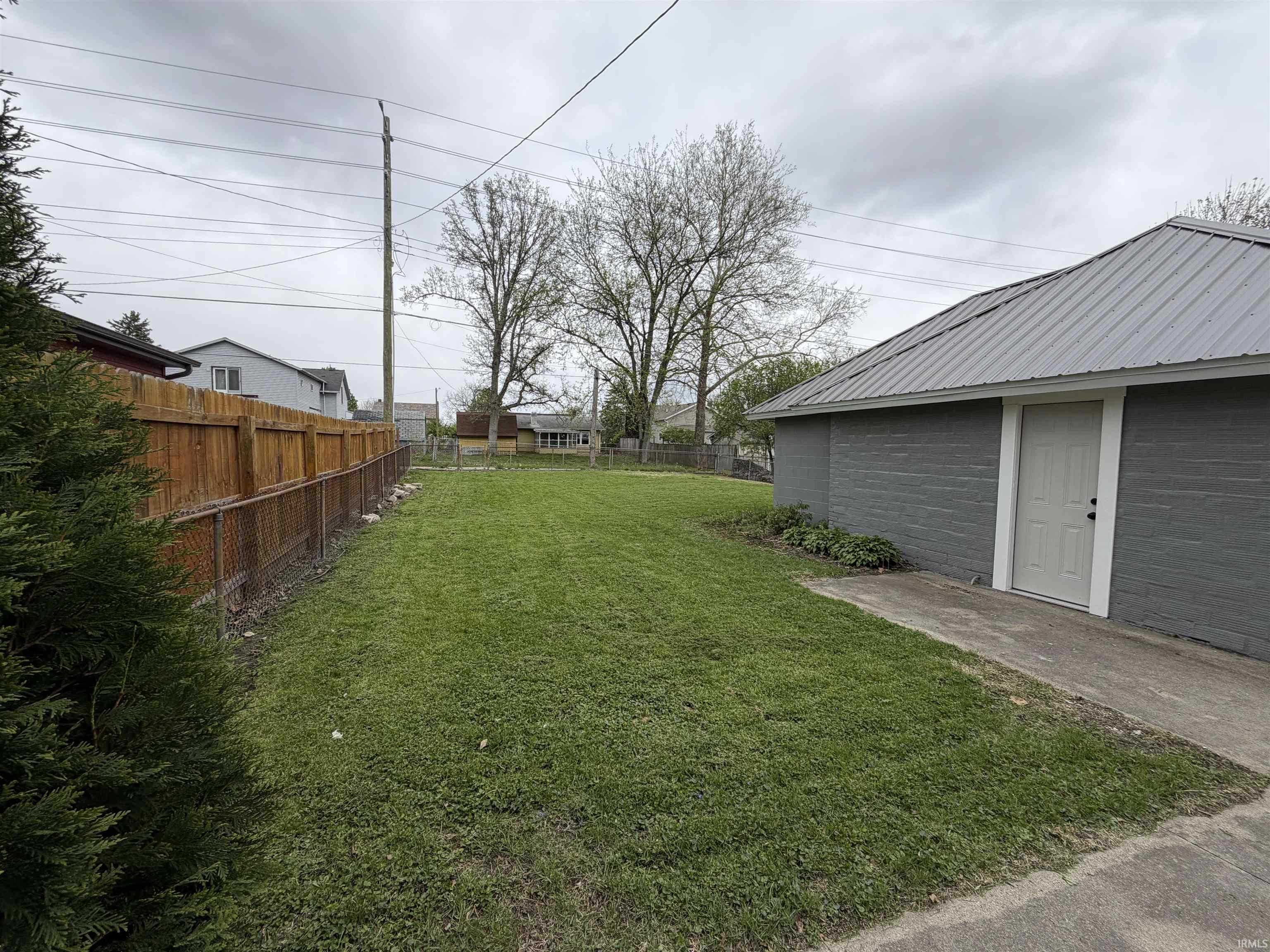 View of fenced backyard