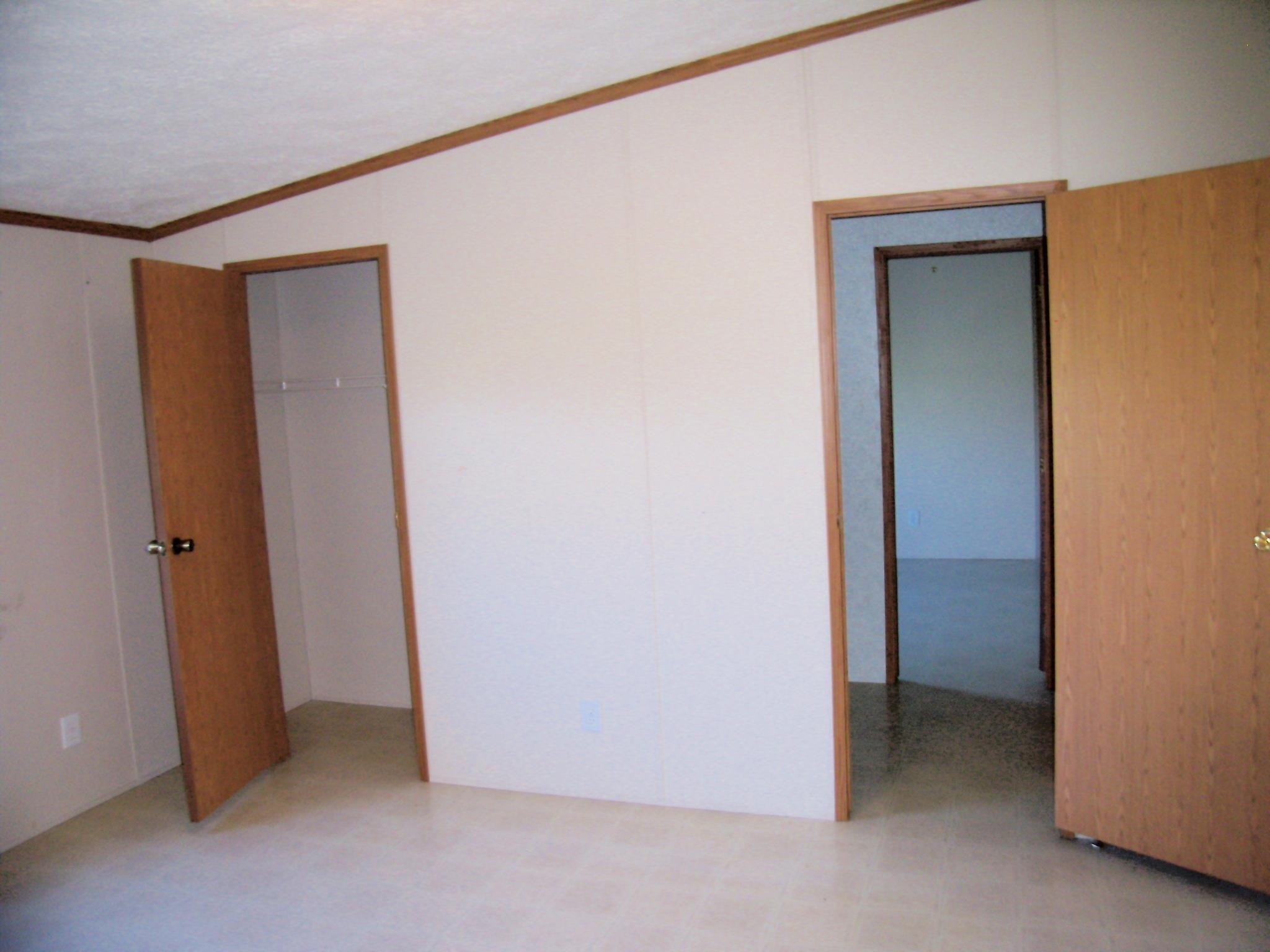 Interior space featuring light-toned walls and wood-finish trim