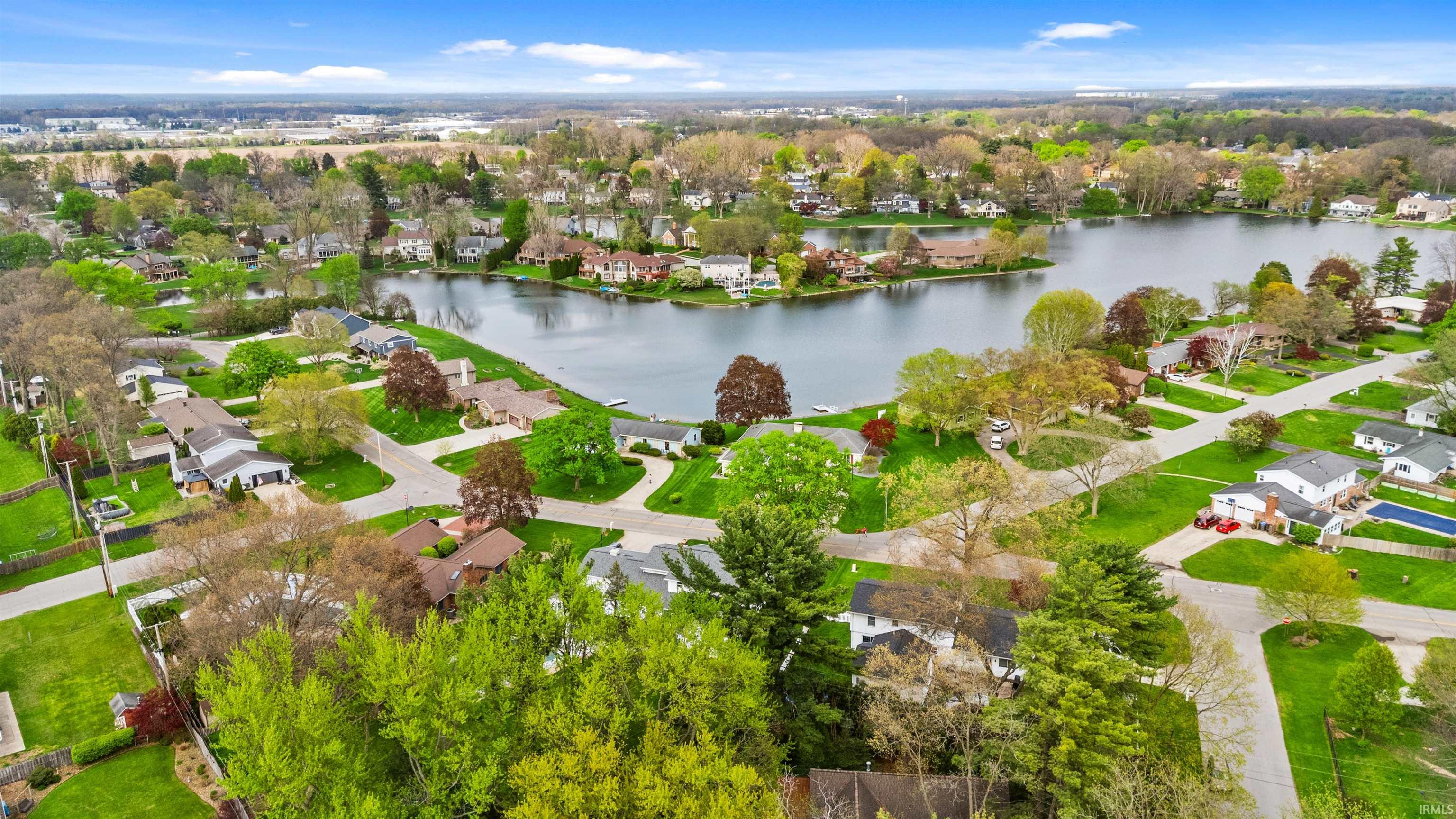 Aerial perspective showcasing a residential area featuring a prominent body of water