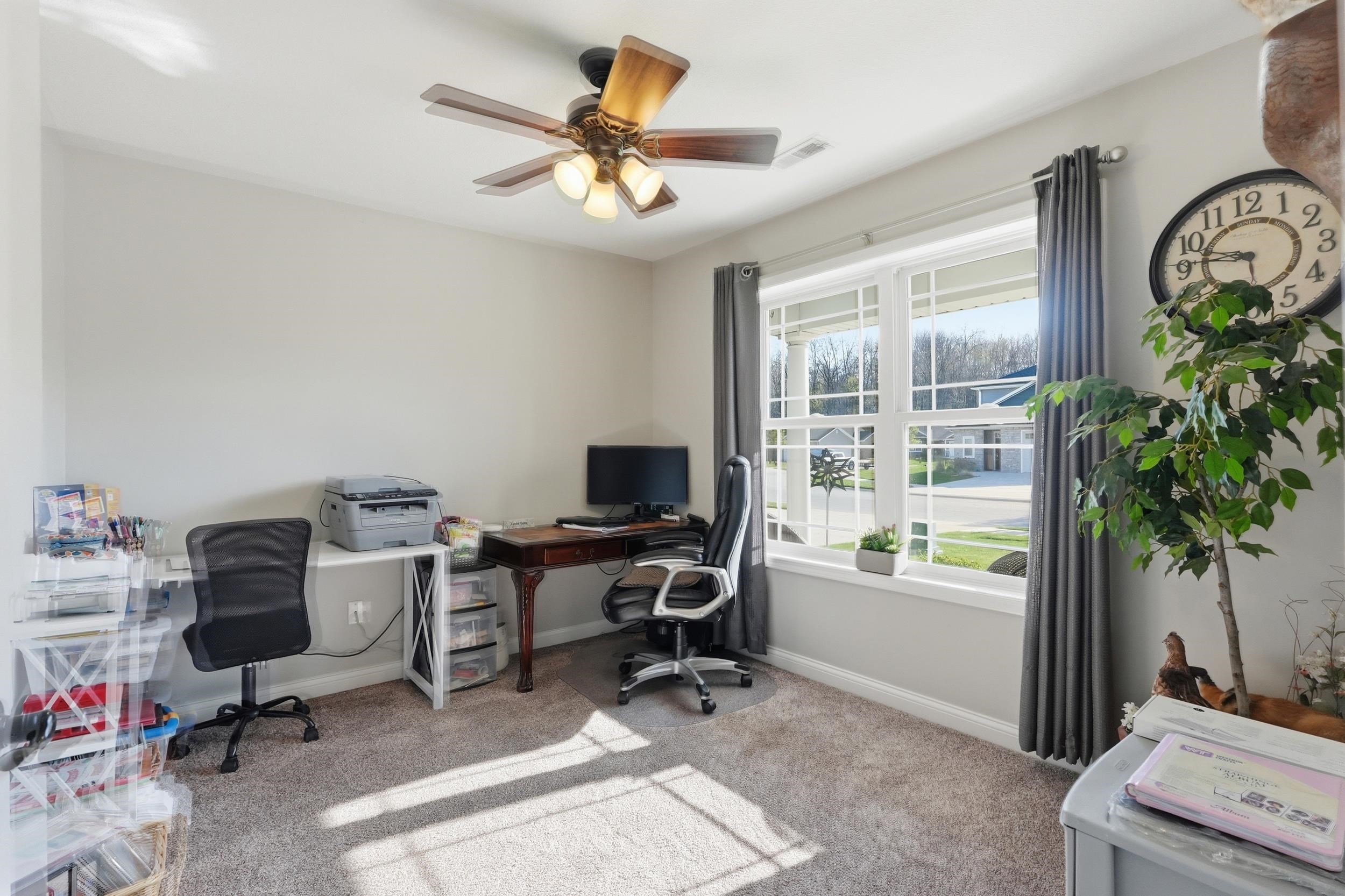 Room featuring carpeted flooring and light gray walls