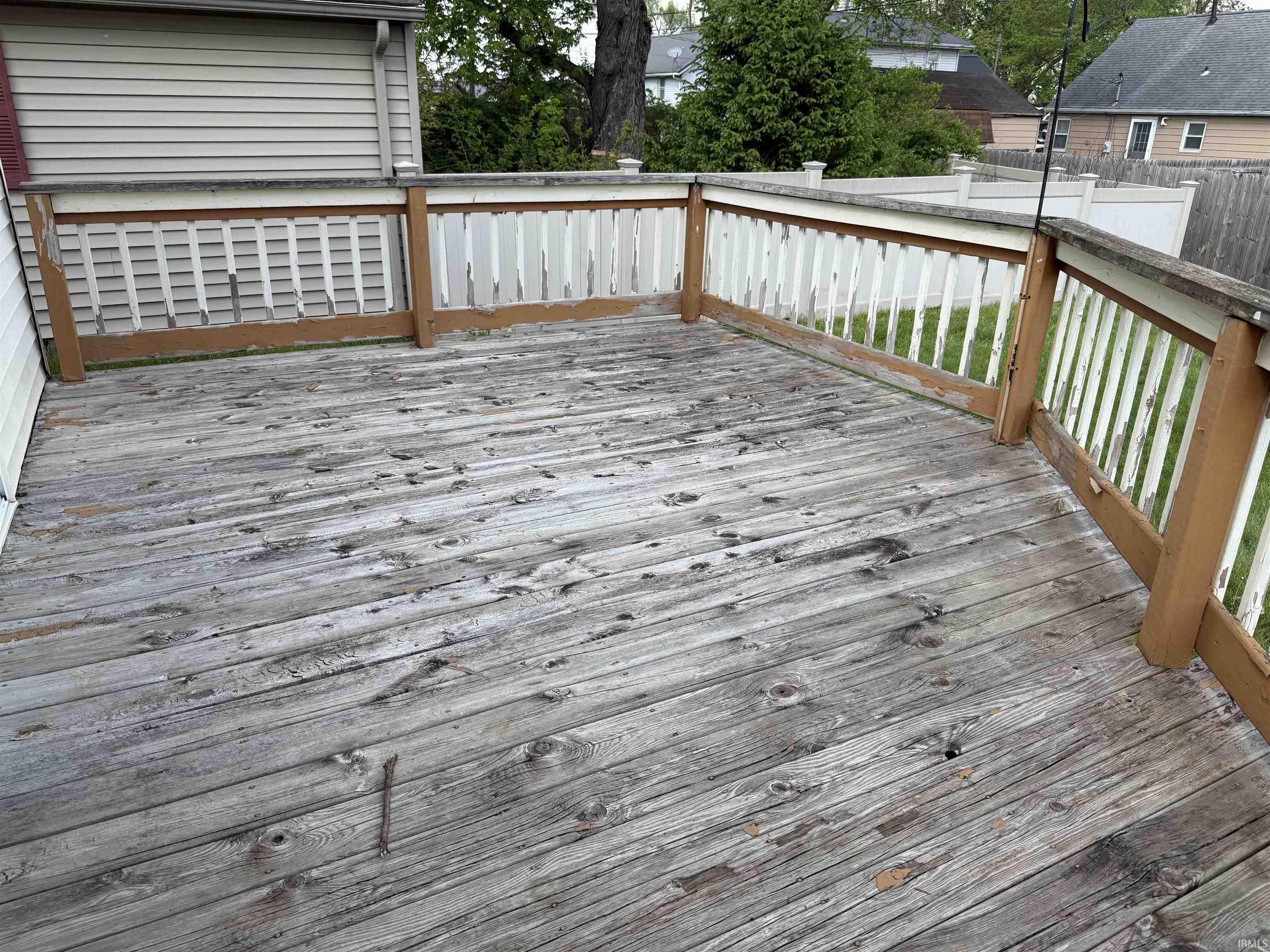 Exterior wood deck with a perimeter railing