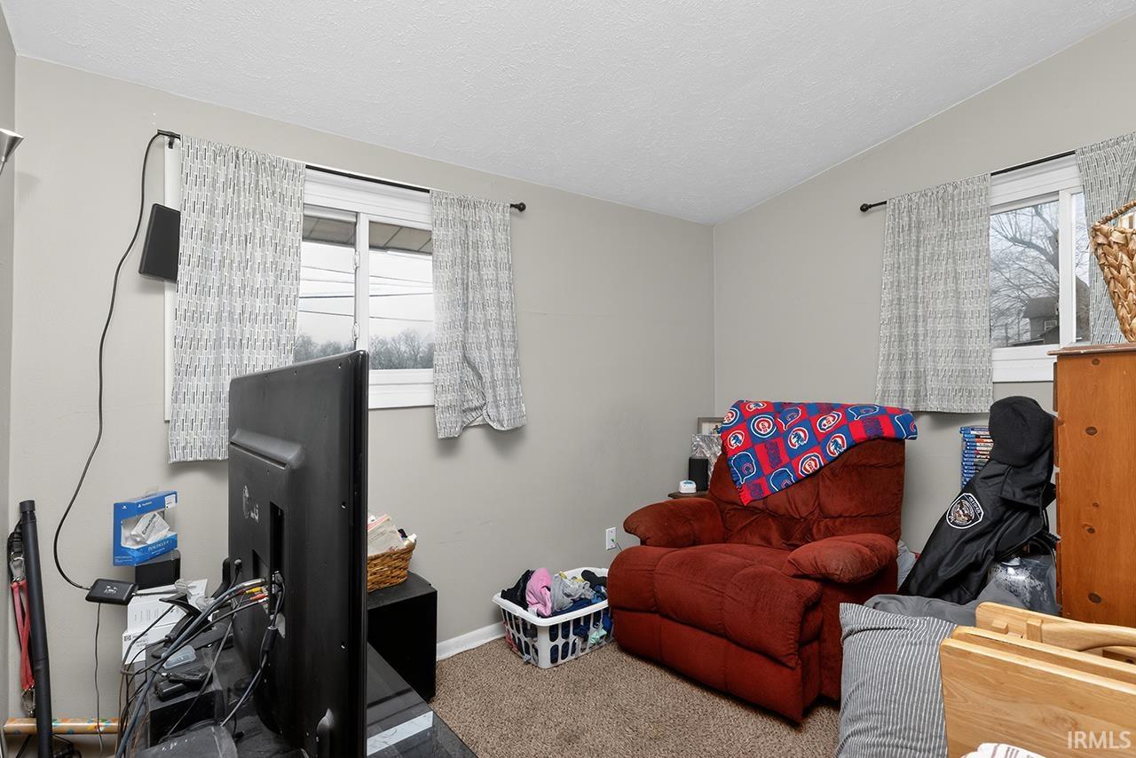 Office featuring carpet and baseboards
