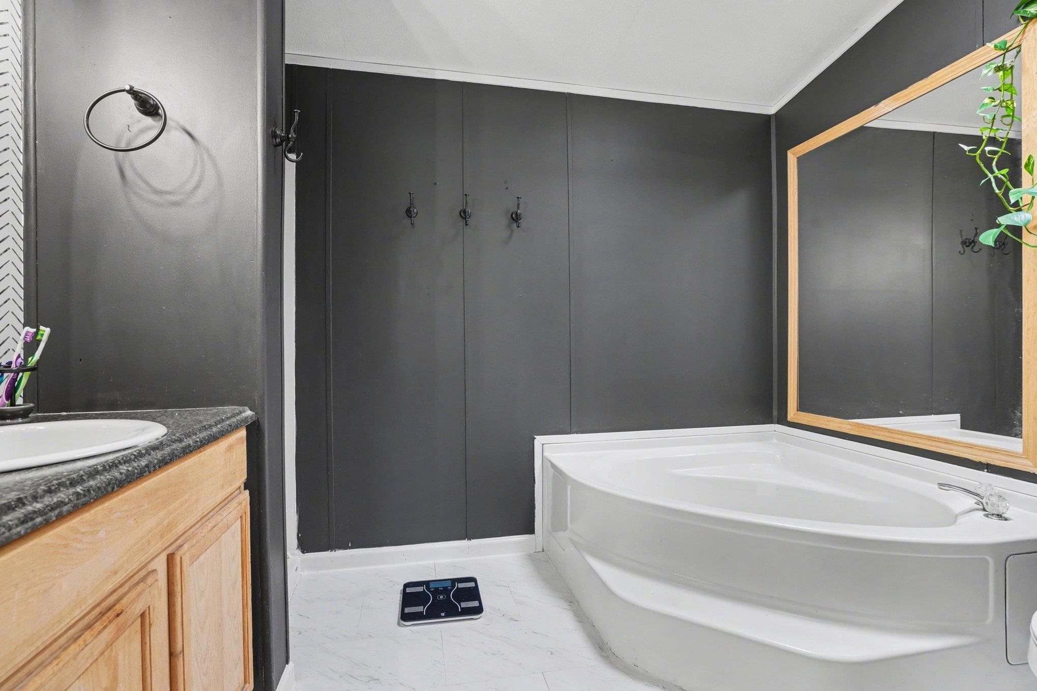 Corner soaking tub with a white finish