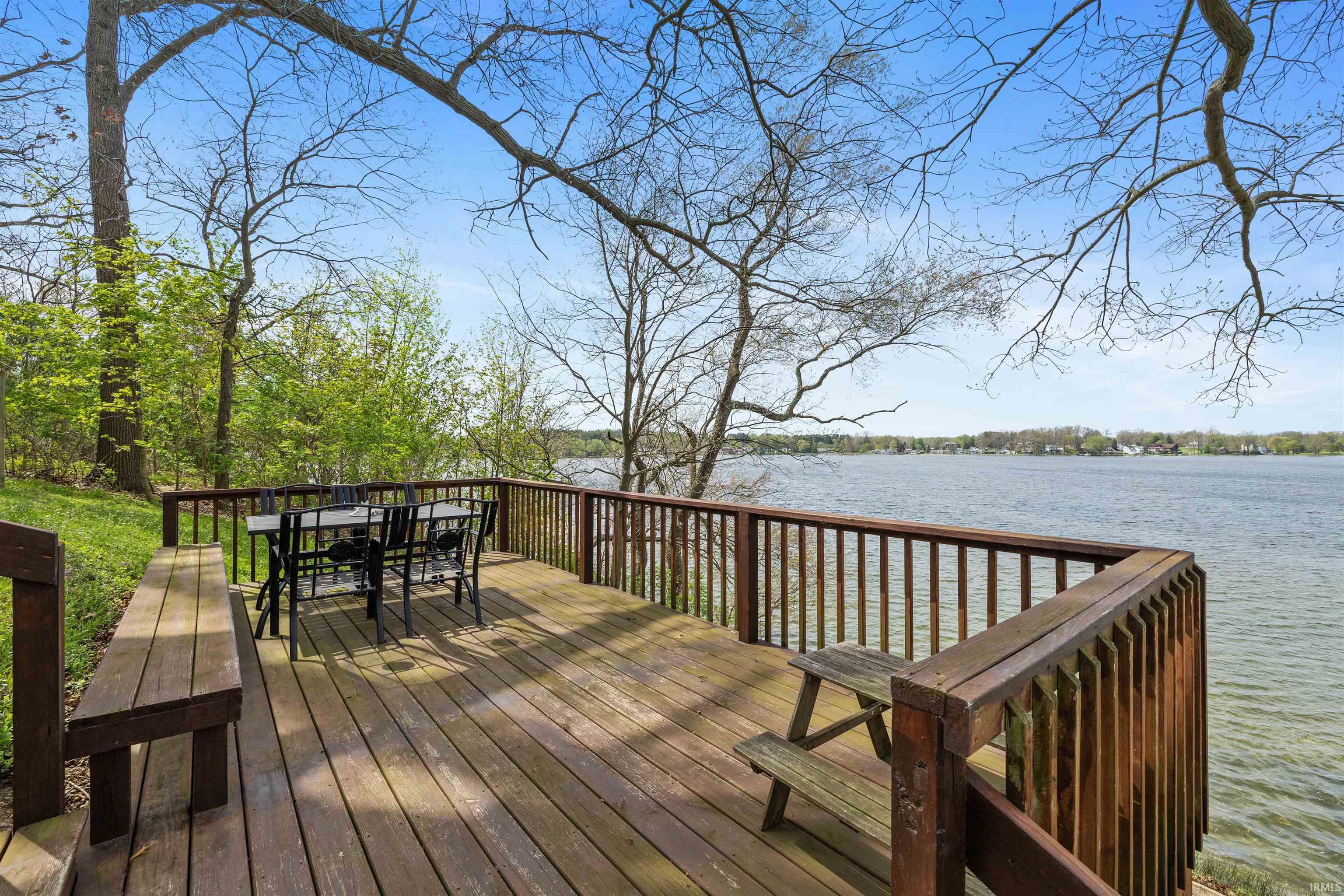 Spacious wood deck with a full railing system
