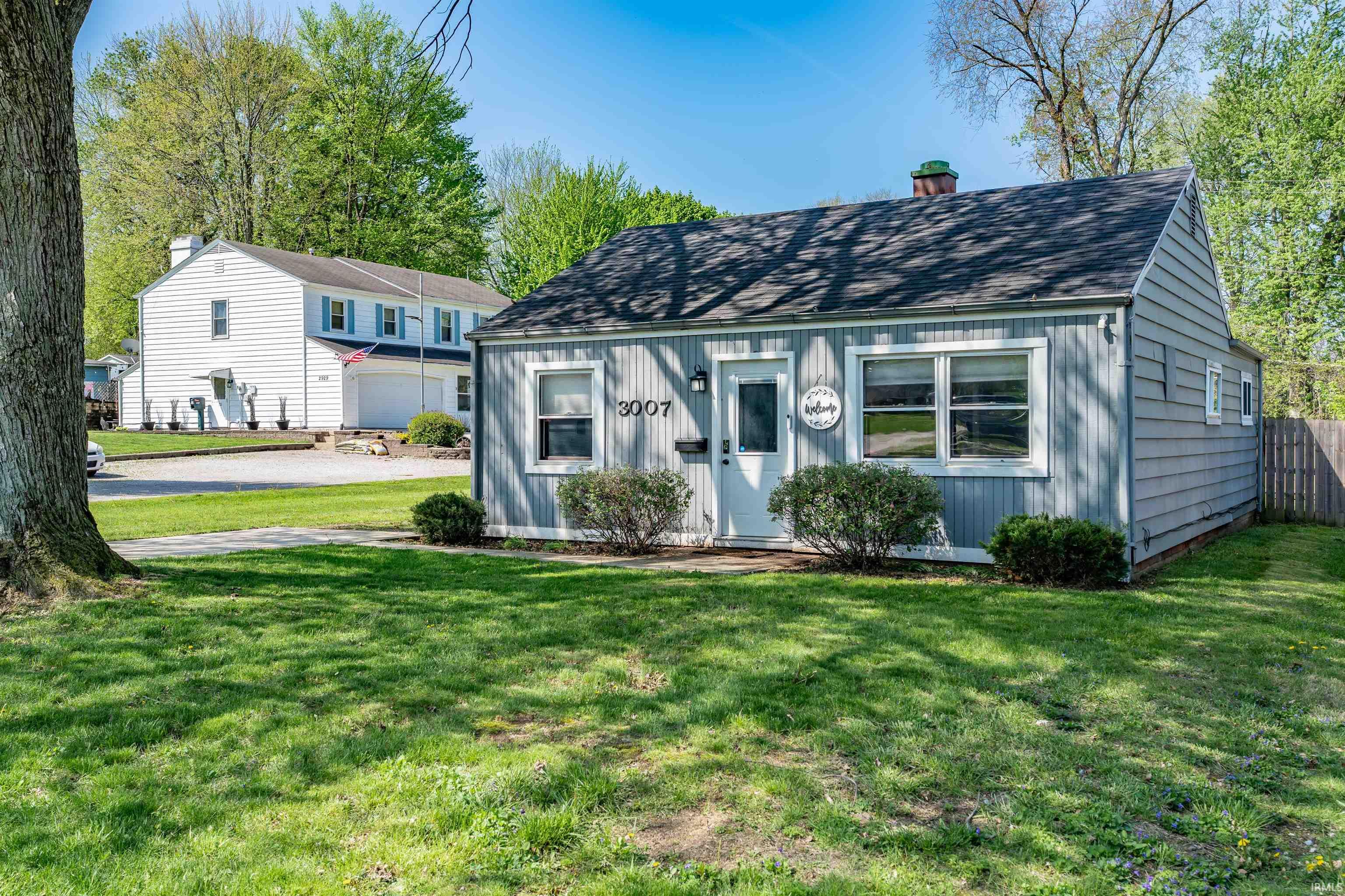 Light gray siding exterior with white trim