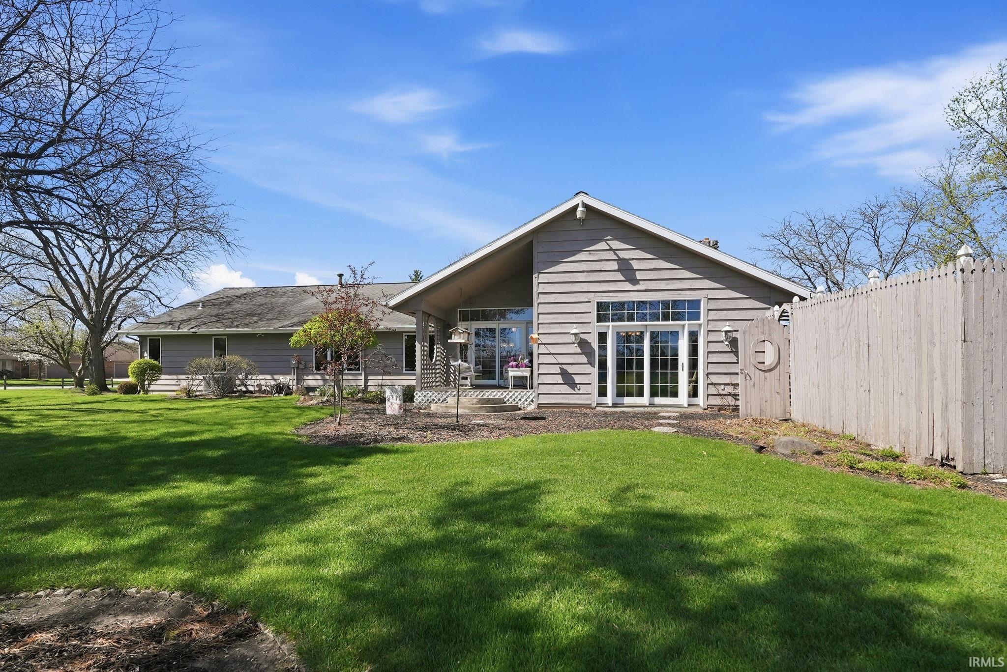 Rear view of property with a patio