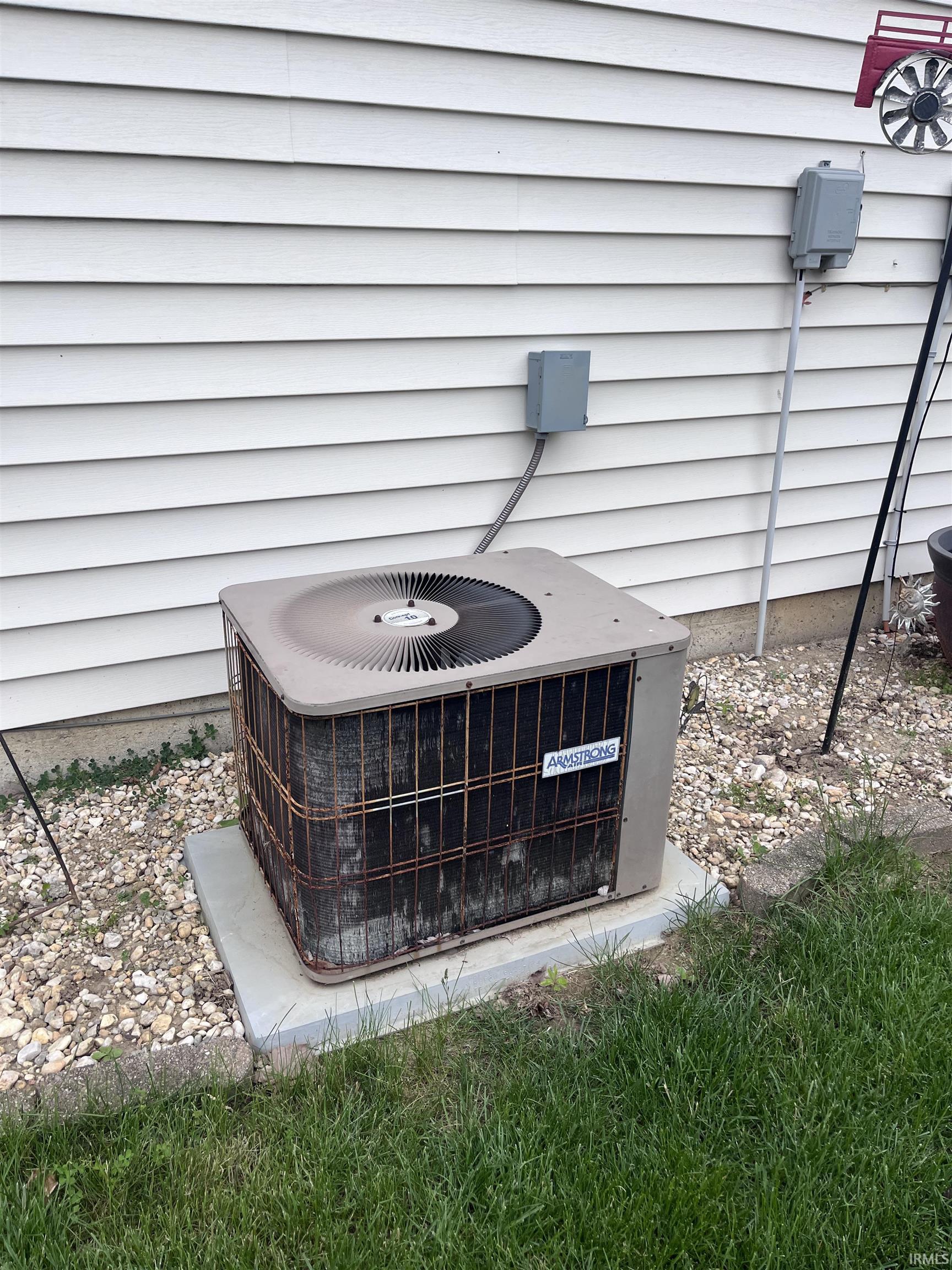 Central air conditioning unit on a concrete pad