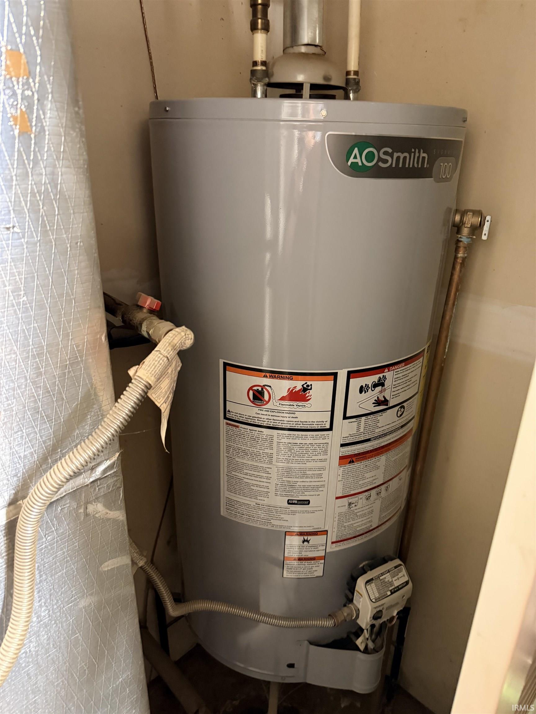 AO Smith water heater with visible plumbing connections
