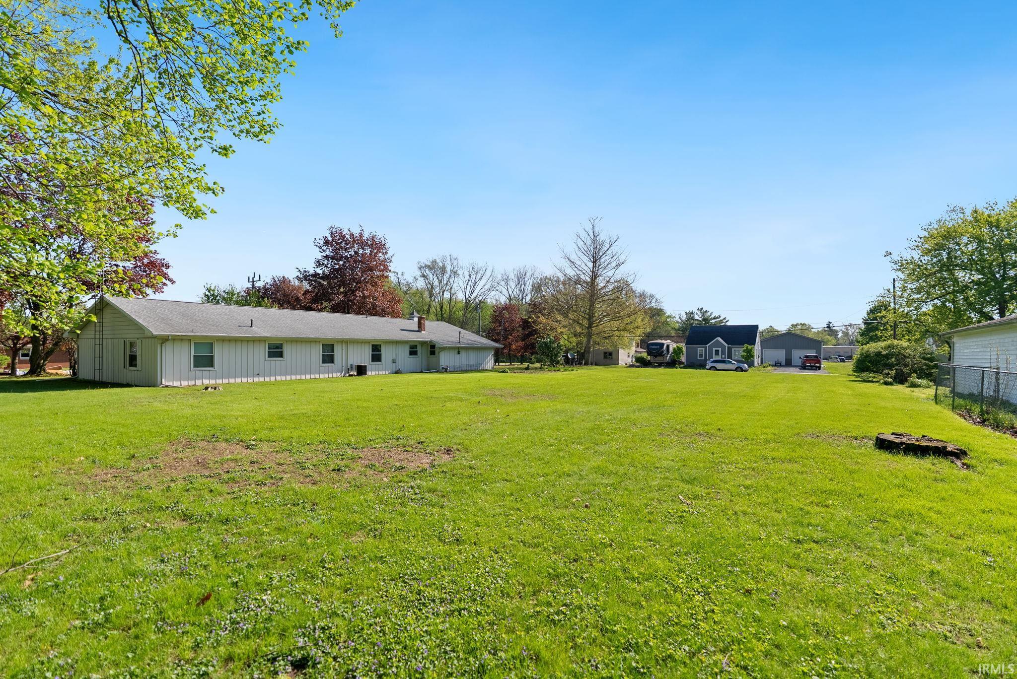 Expansive green lawn providing ample outdoor space