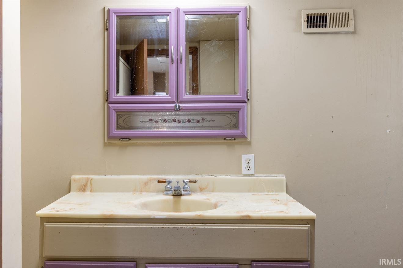 Vanity with integrated sink and chrome faucet set