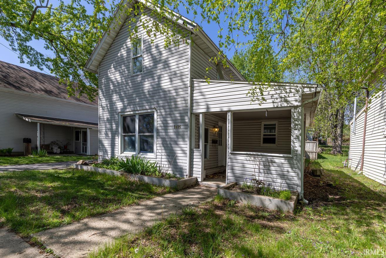 Two-story exterior with light-colored siding