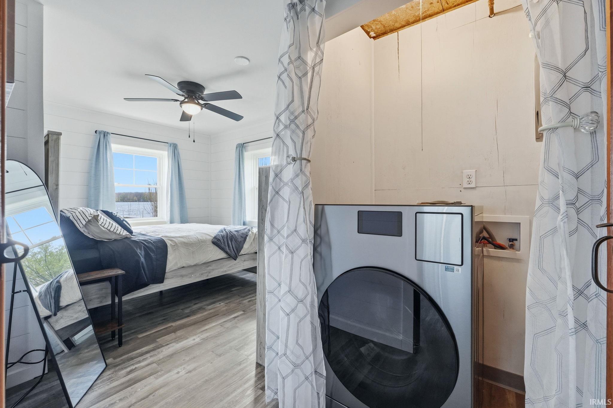 Dedicated laundry area featuring a front-loading appliance