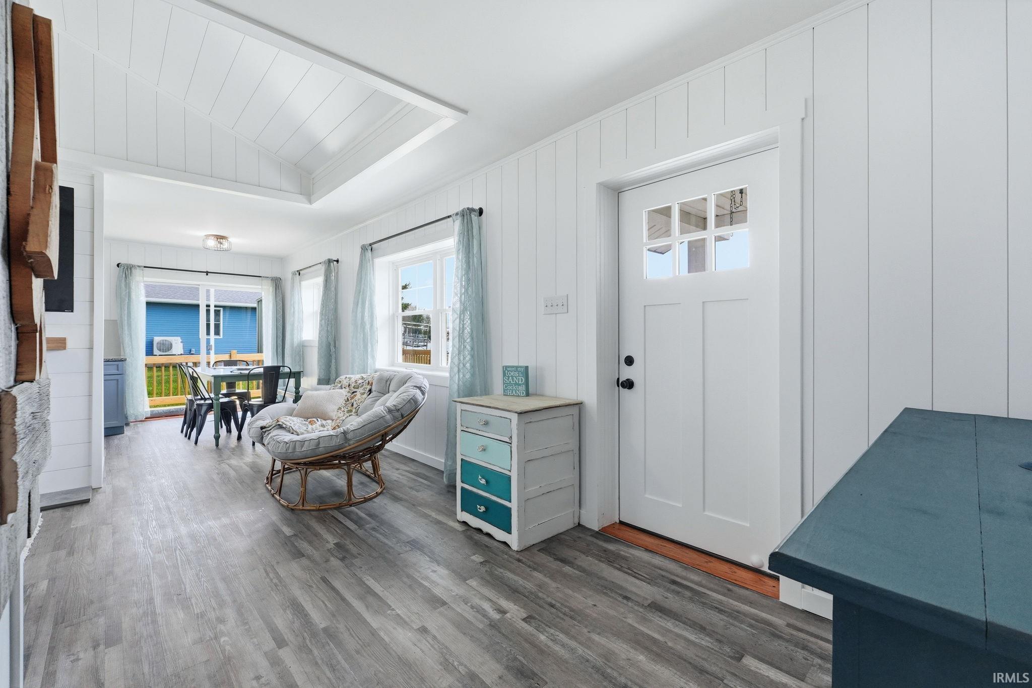 Inviting interior featuring wood-finish flooring and vertical paneling