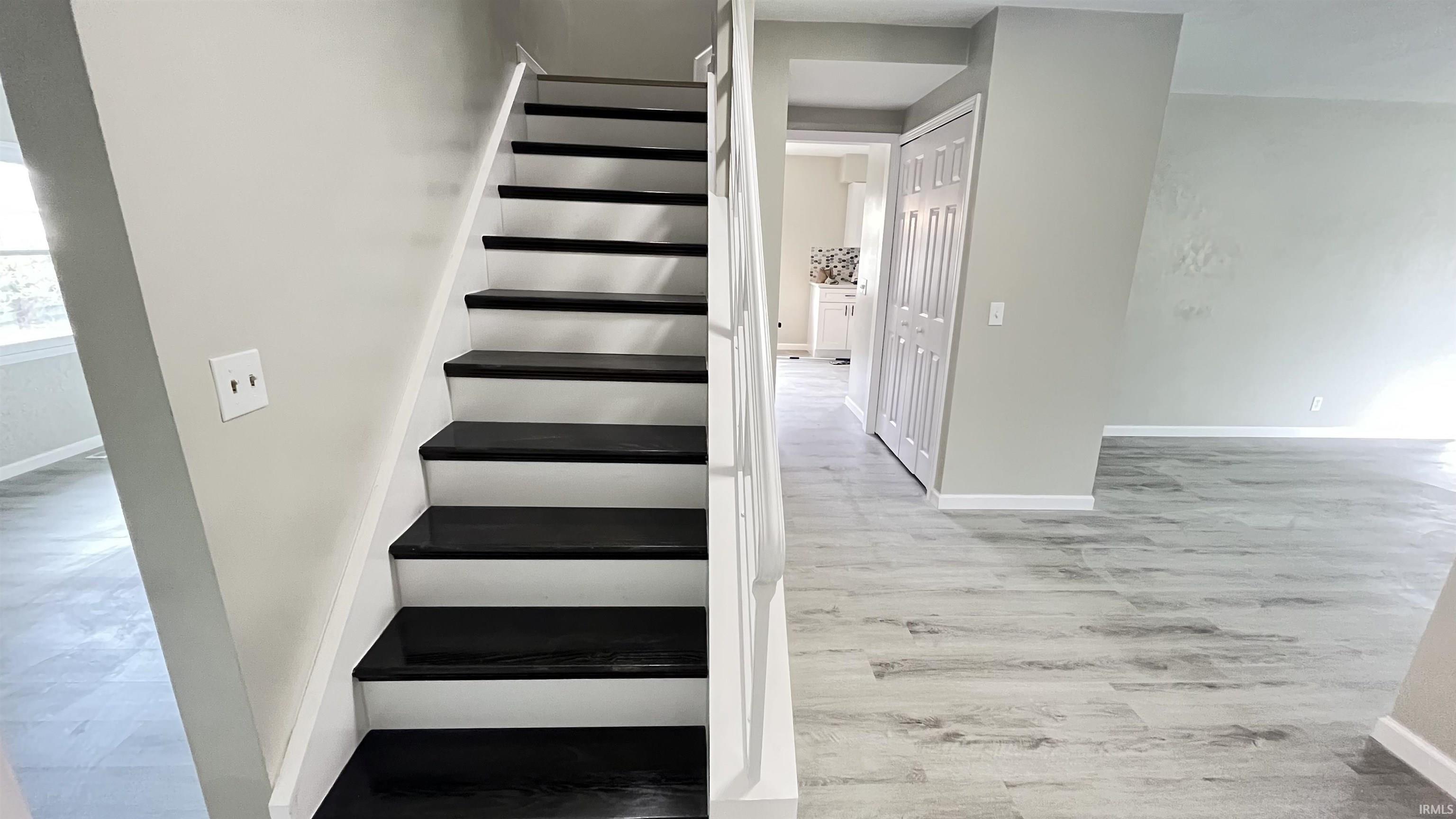 Staircase with contrasting black treads and white risers