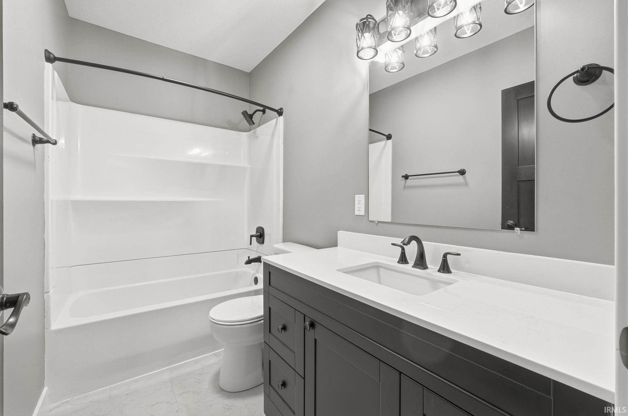 Full bathroom with vanity and bathing tub / shower combination