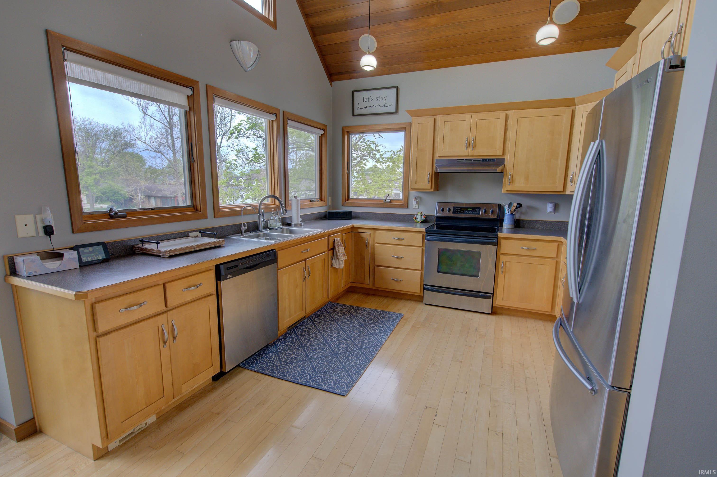 Kitchen featuring light wood cabinetry and light wood-finish flooring