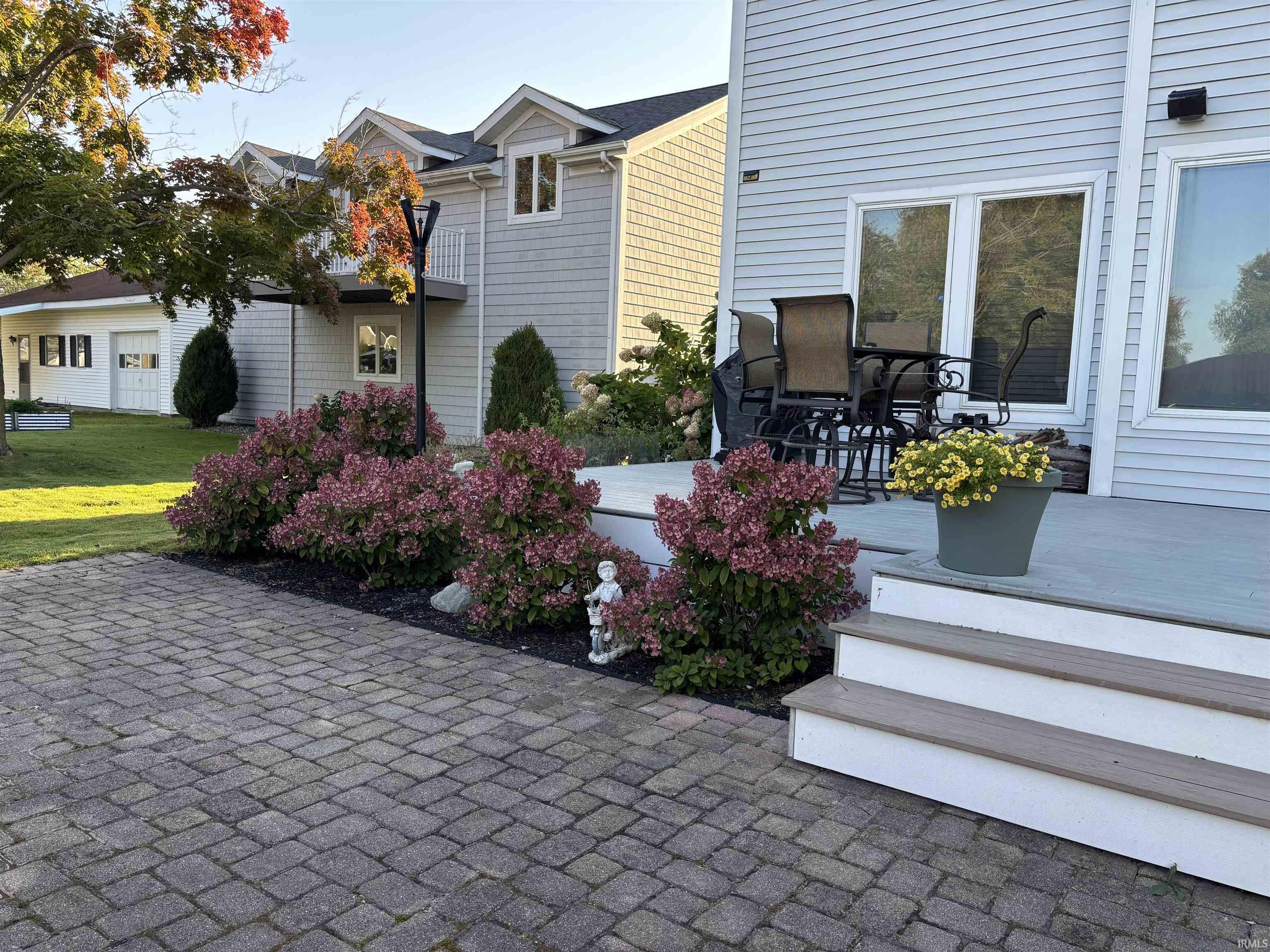 Exterior patio space featuring paver flooring