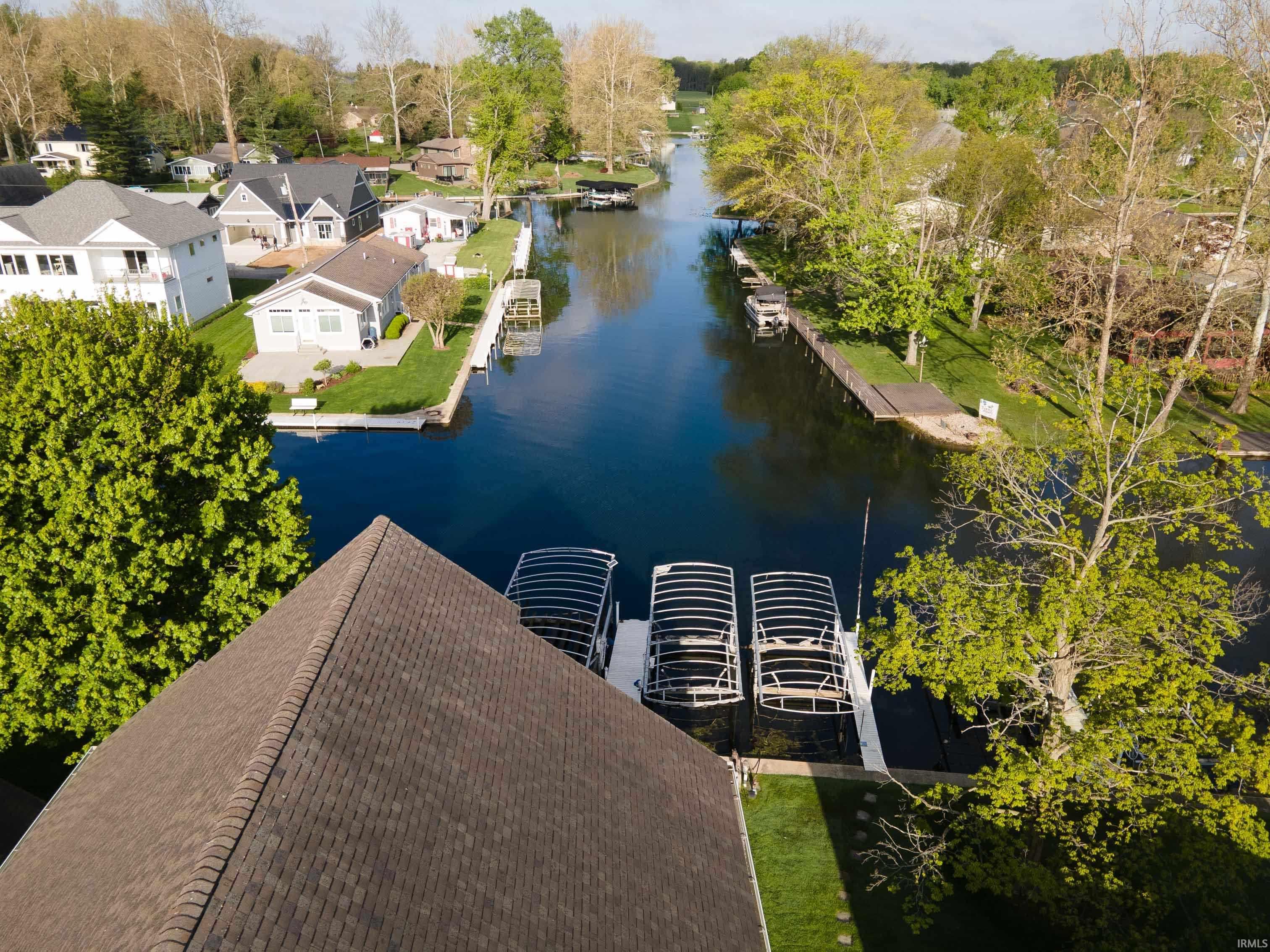 Waterfront property featuring multiple boat lifts and docks