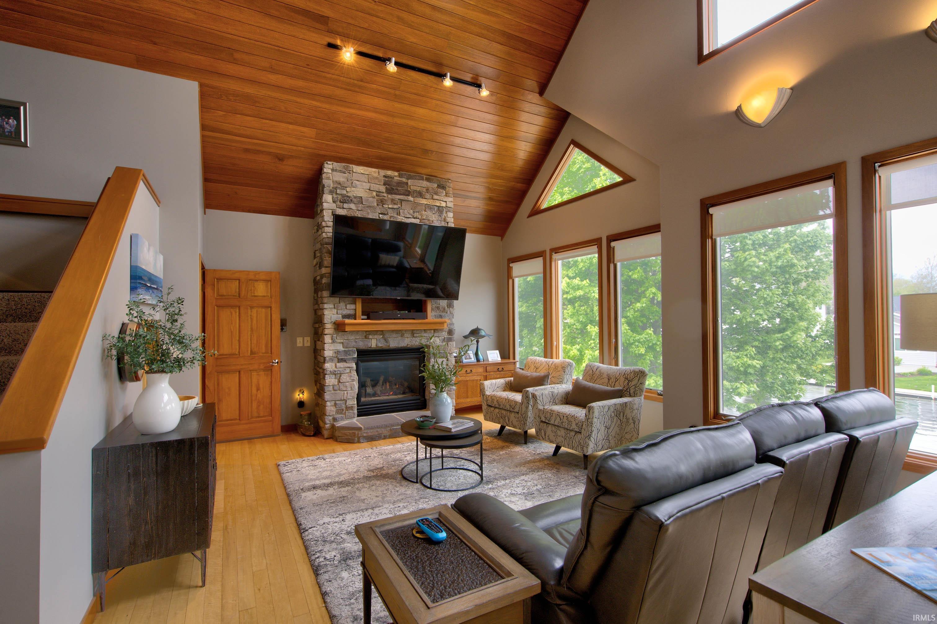 Vaulted wood-paneled ceiling with track lighting