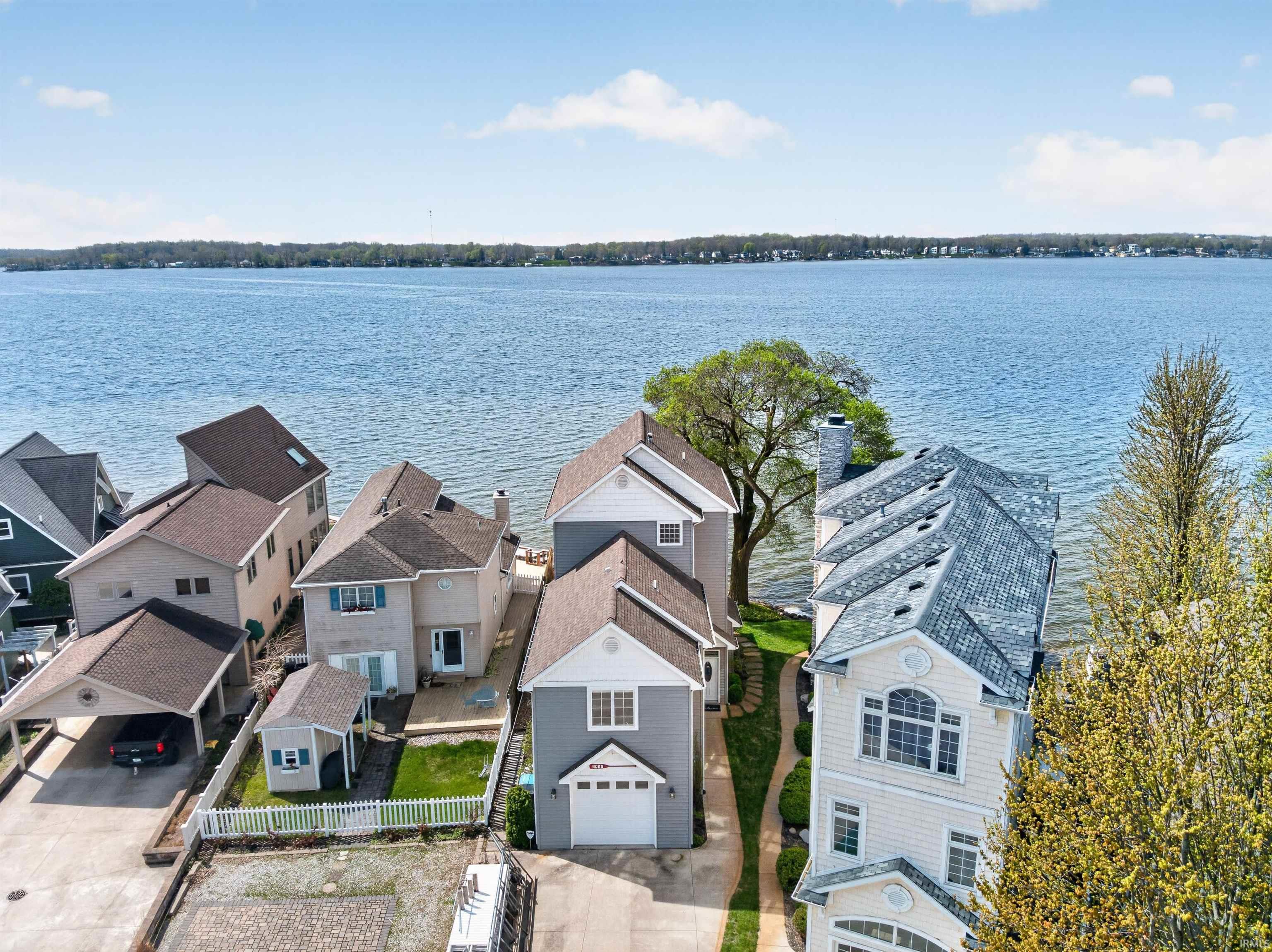 Aerial view of residential area with a large body of water
